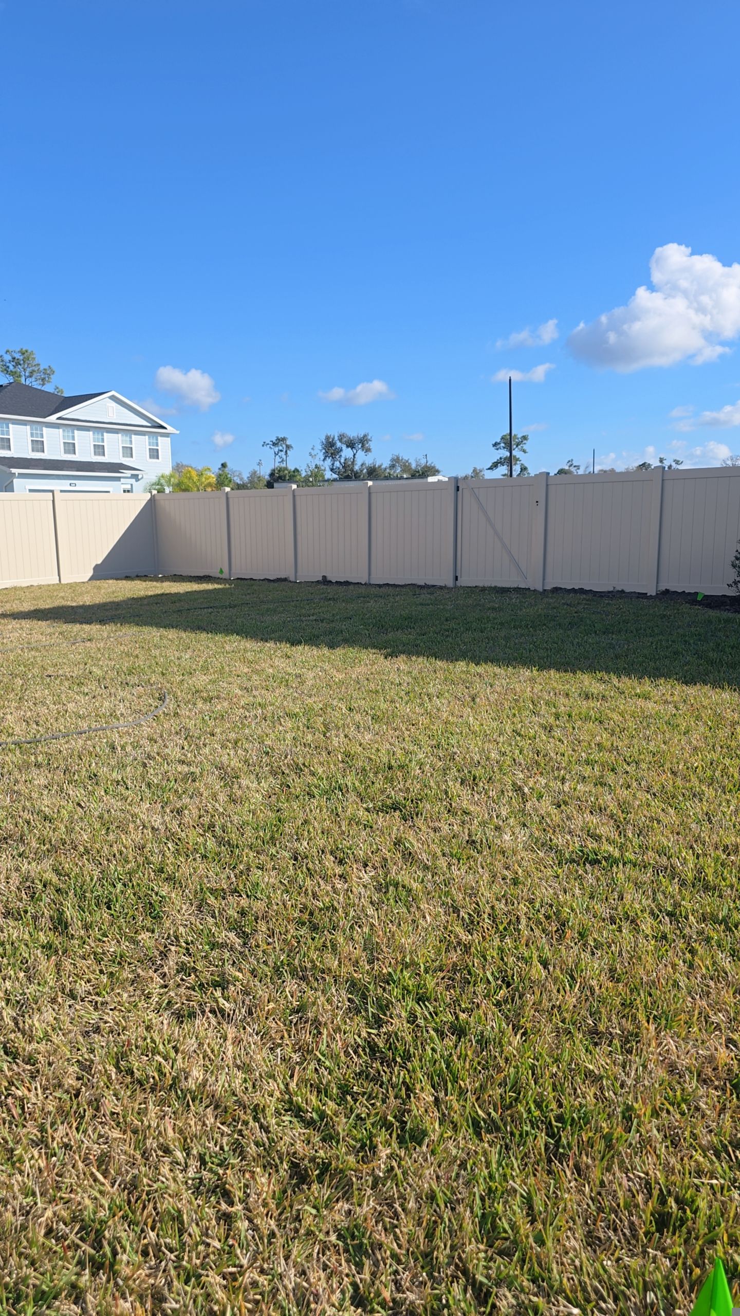 Tan Vinyl Fence in West Port by True Fence LLC