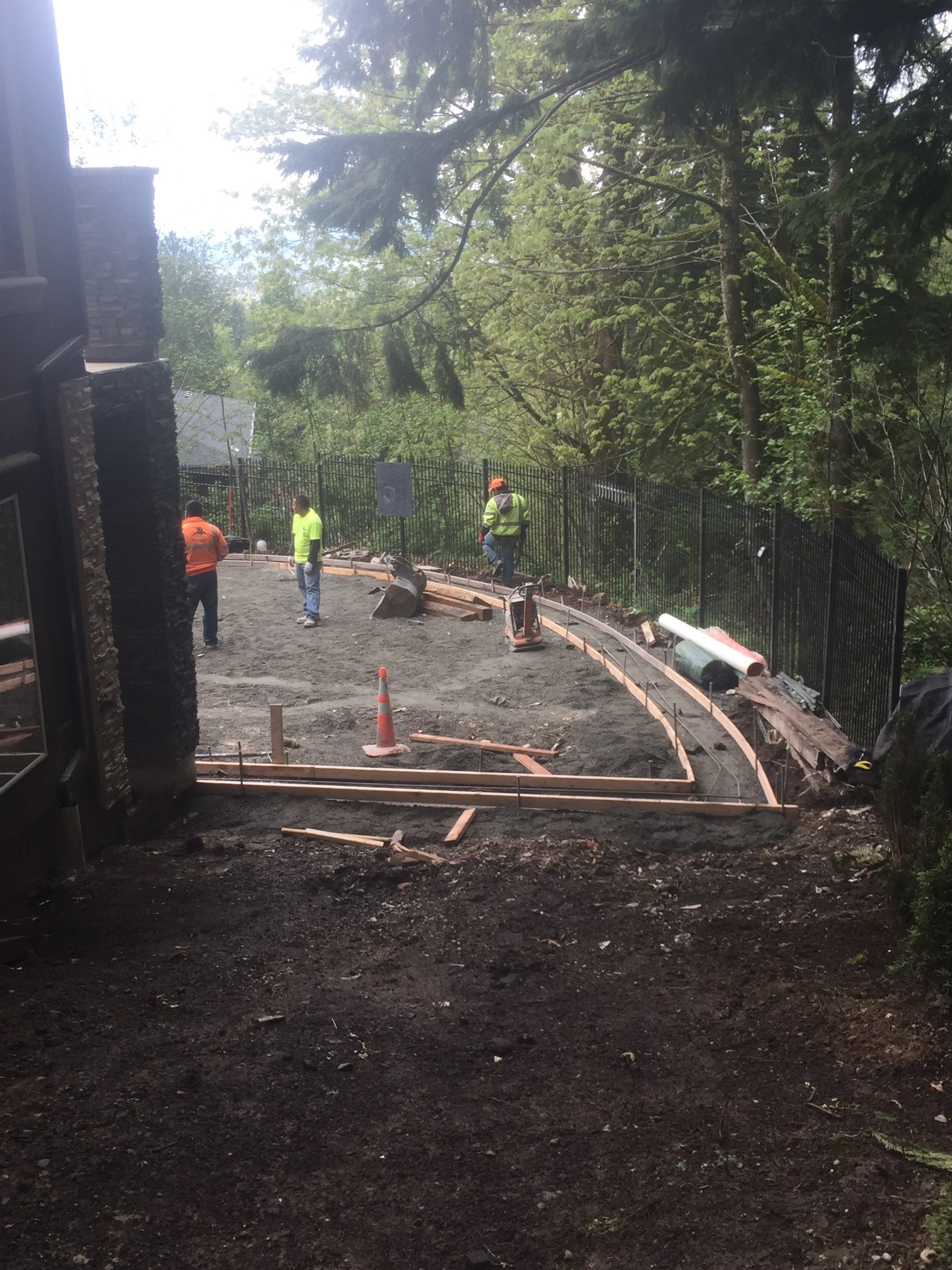 Asphalt Driveway and Stamped Concrete Patio Finish  by Jireh Asphalt & Concrete Inc 