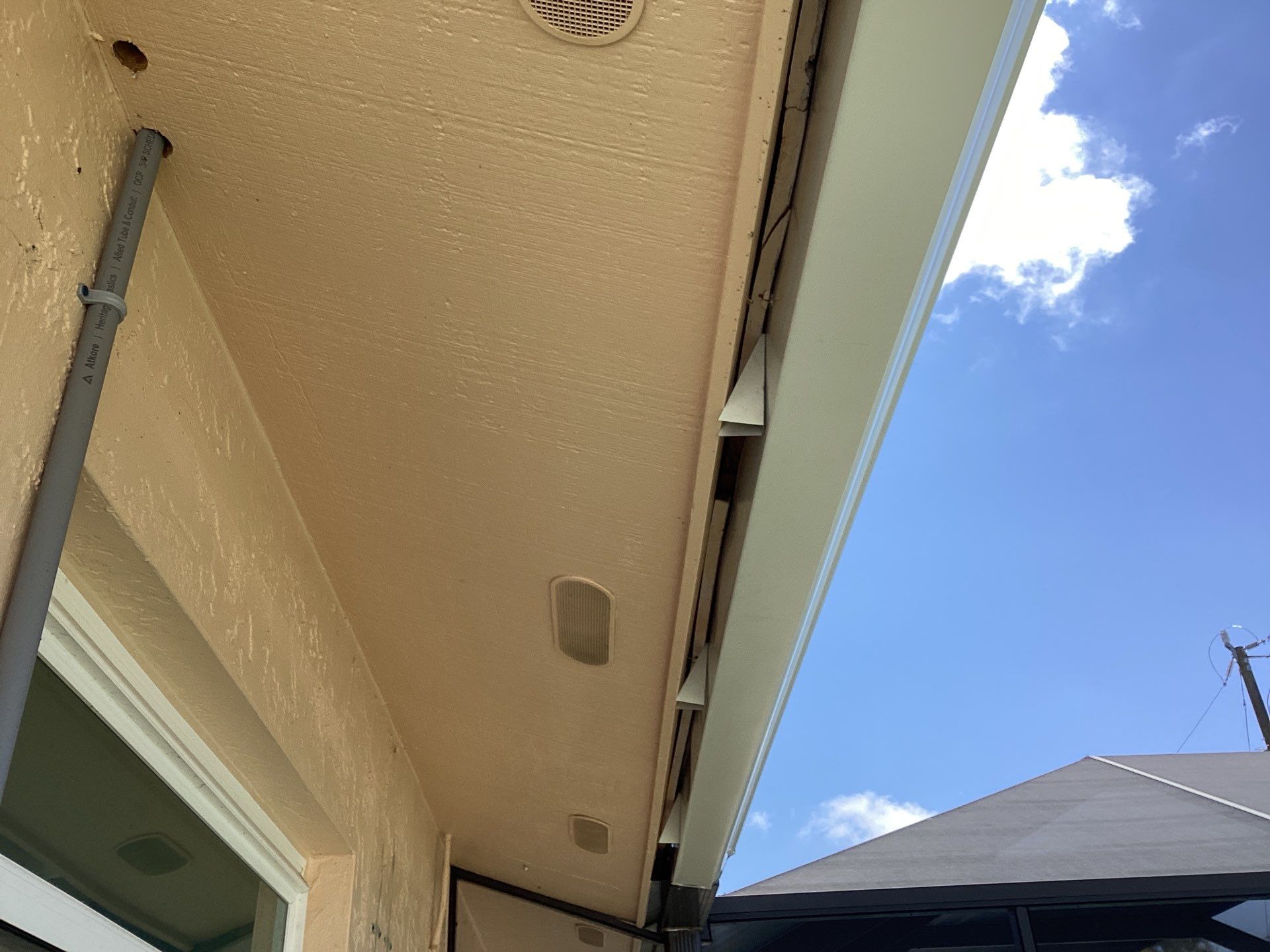 White K Style Seamless Gutters using 3X4 Elbow Downspout in Cape Coral FL by Gutter Professors