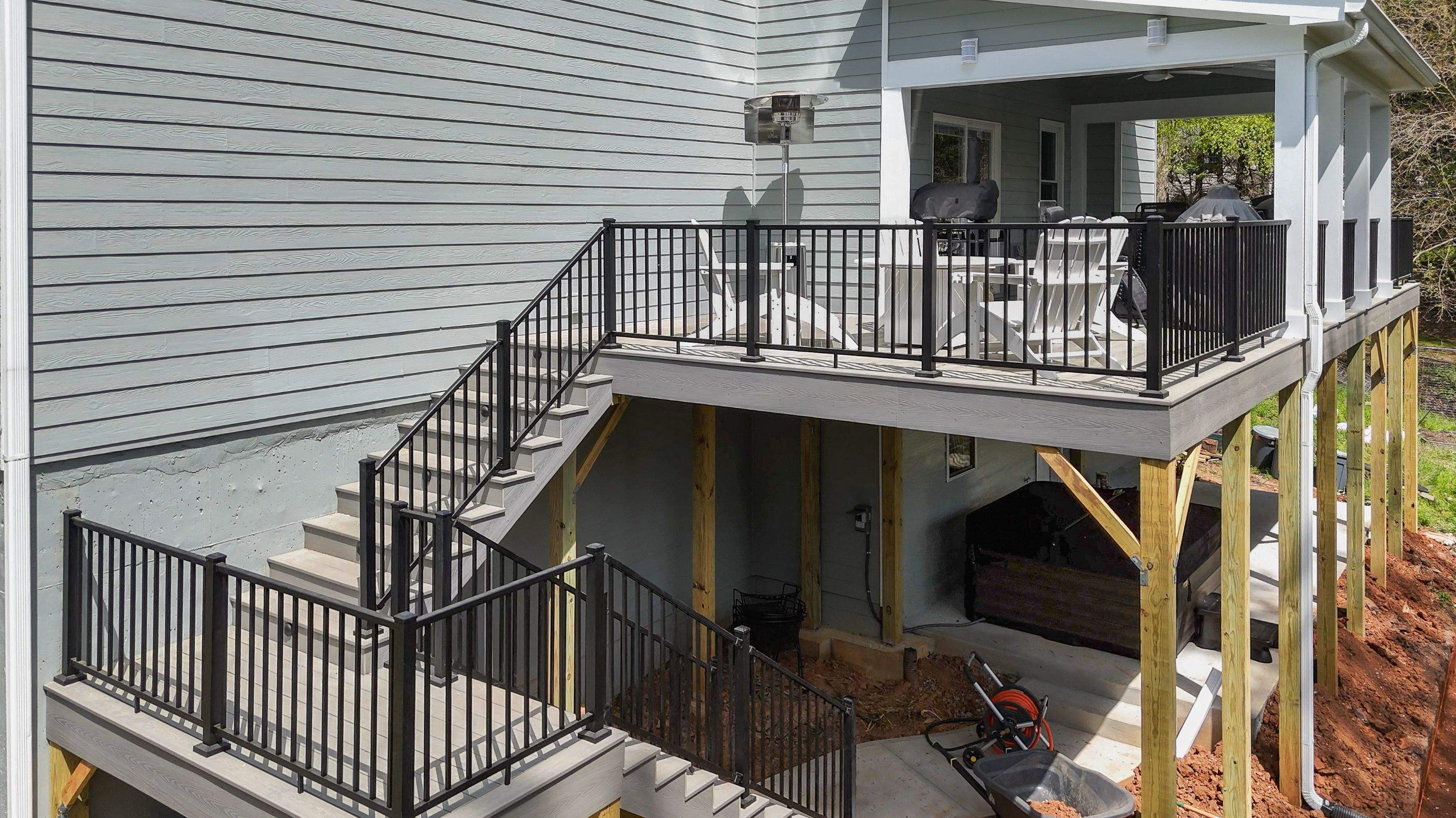 Covered Porch and Deck Build using Deckorators Venture Series Decking and Trex Select Aluminum Railing by Nelson Exteriors