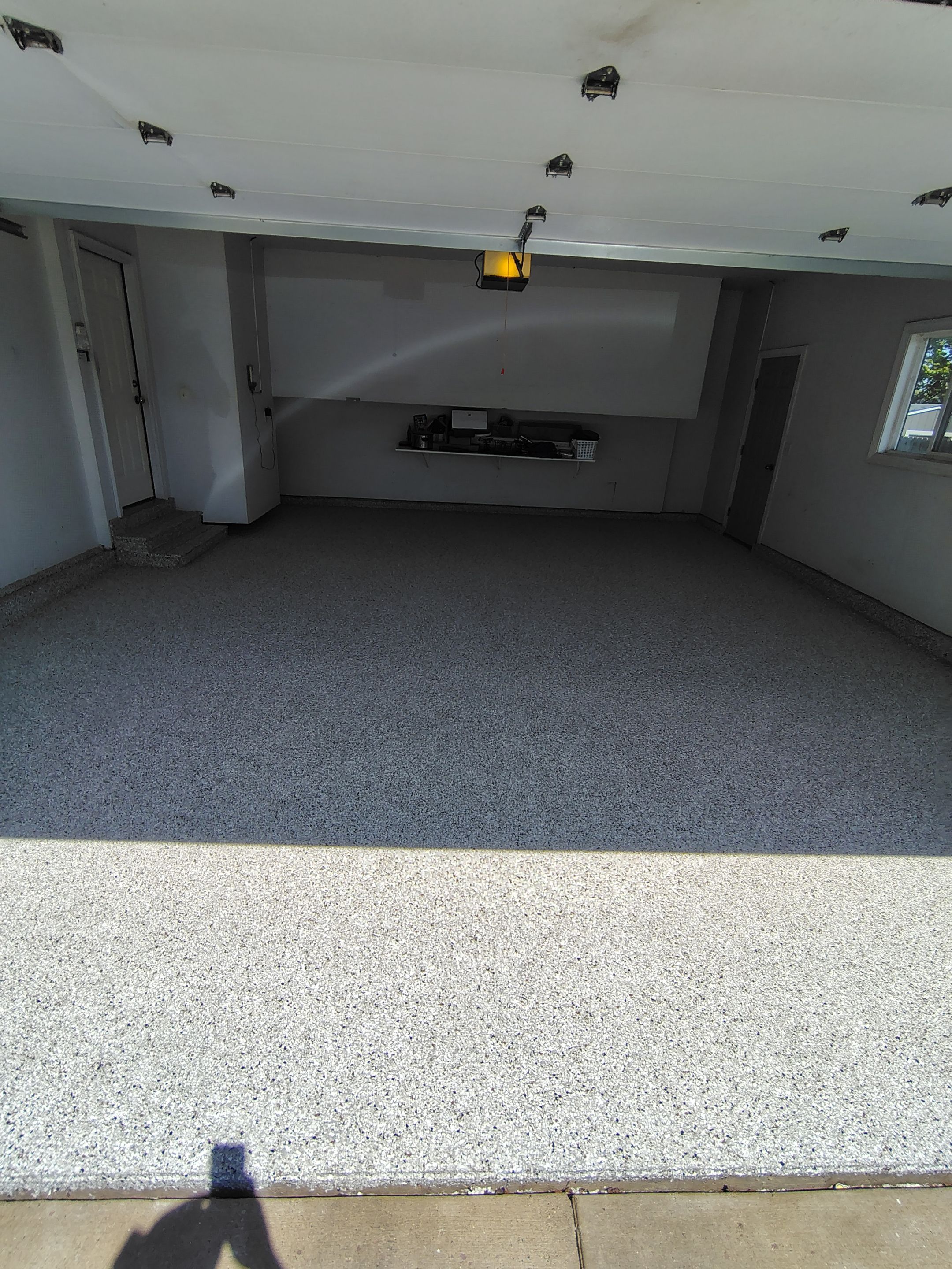 Decorative Chip Epoxy Garage Floor Coating in Sioux Falls by Select Painting, Coatings & Garage Cabinets