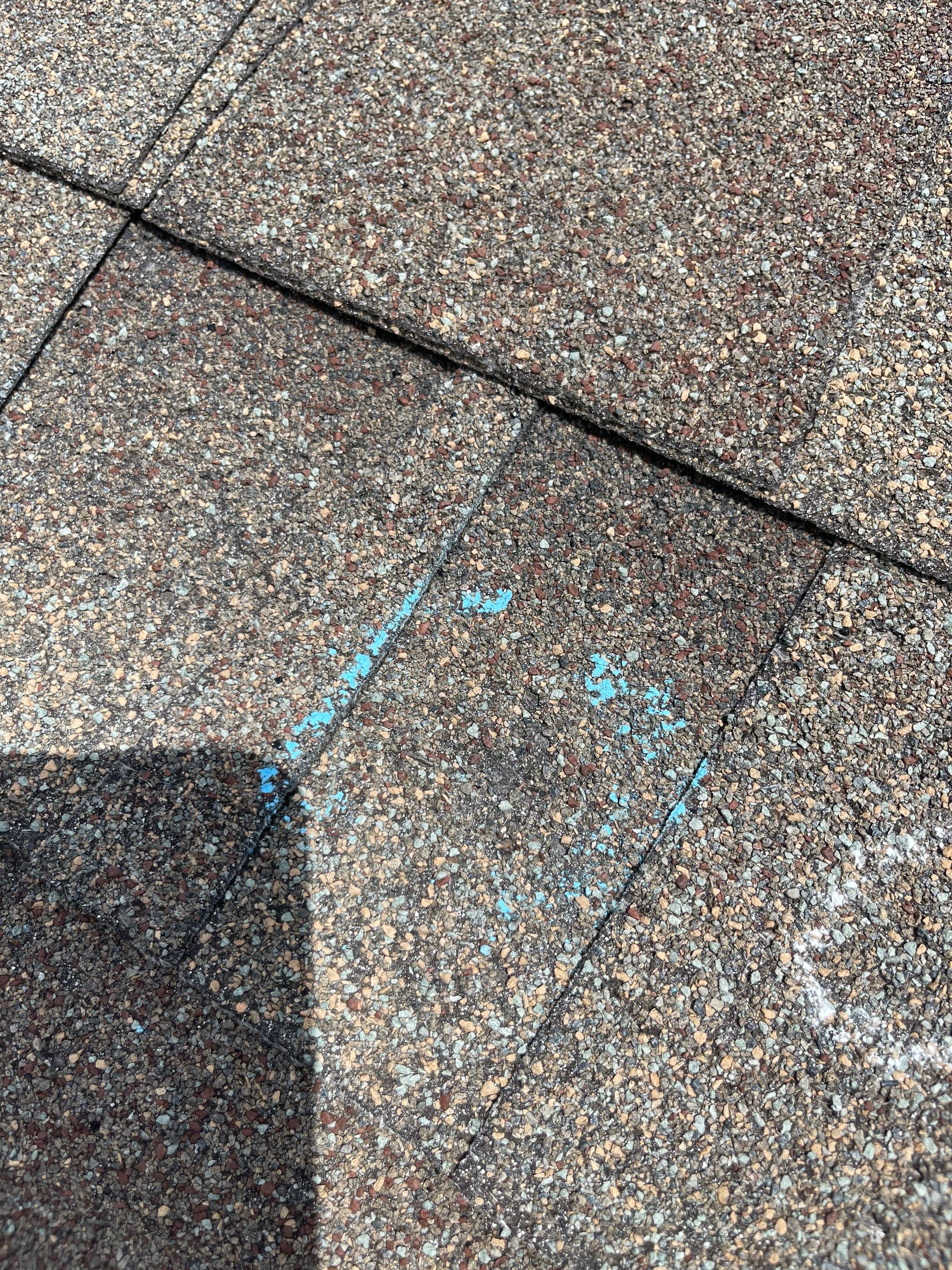 Hail Damage on a Roofing System by Icon Roofing And Construction 