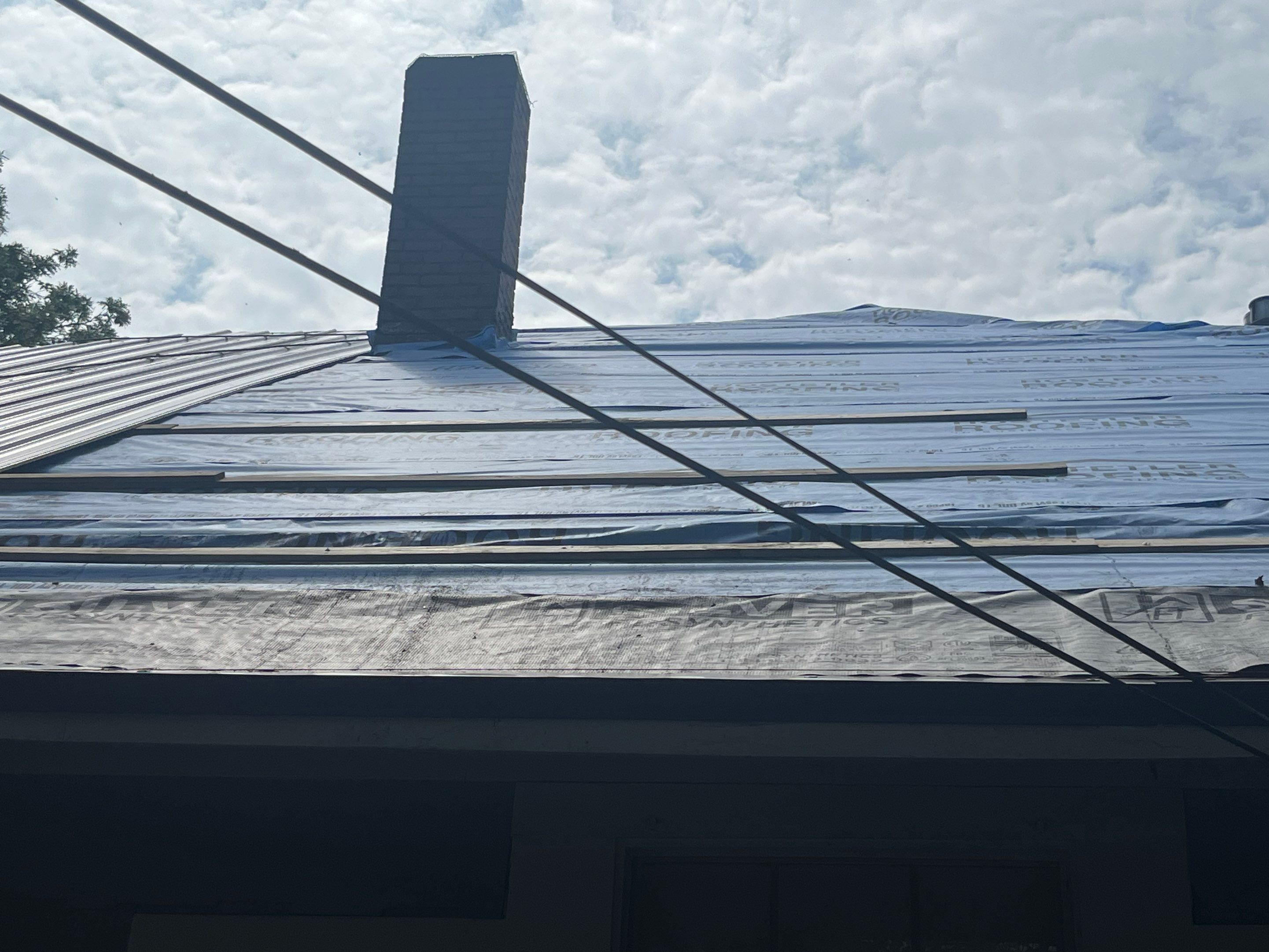 Residential Metal Roof Replacement using Reed's Metals: Colored Residental Panel (Burgundy) by Hostetler Roofing