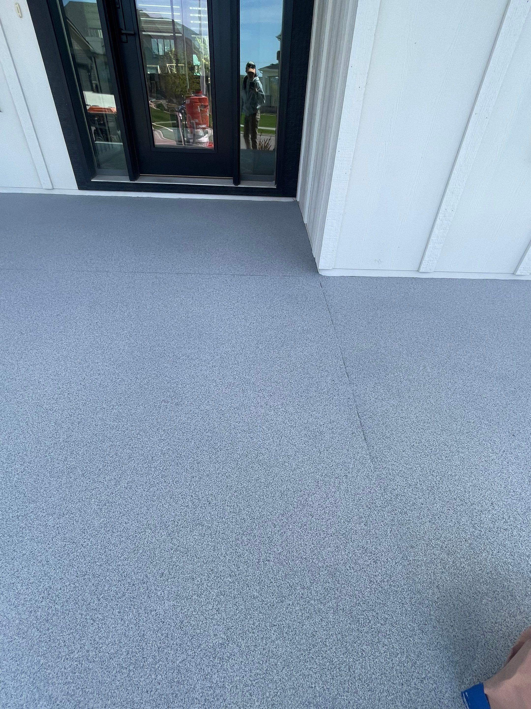 Grey Speckled Concrete Porch Coating for Sioux Falls Home by Select Painting, Coatings & Garage Cabinets