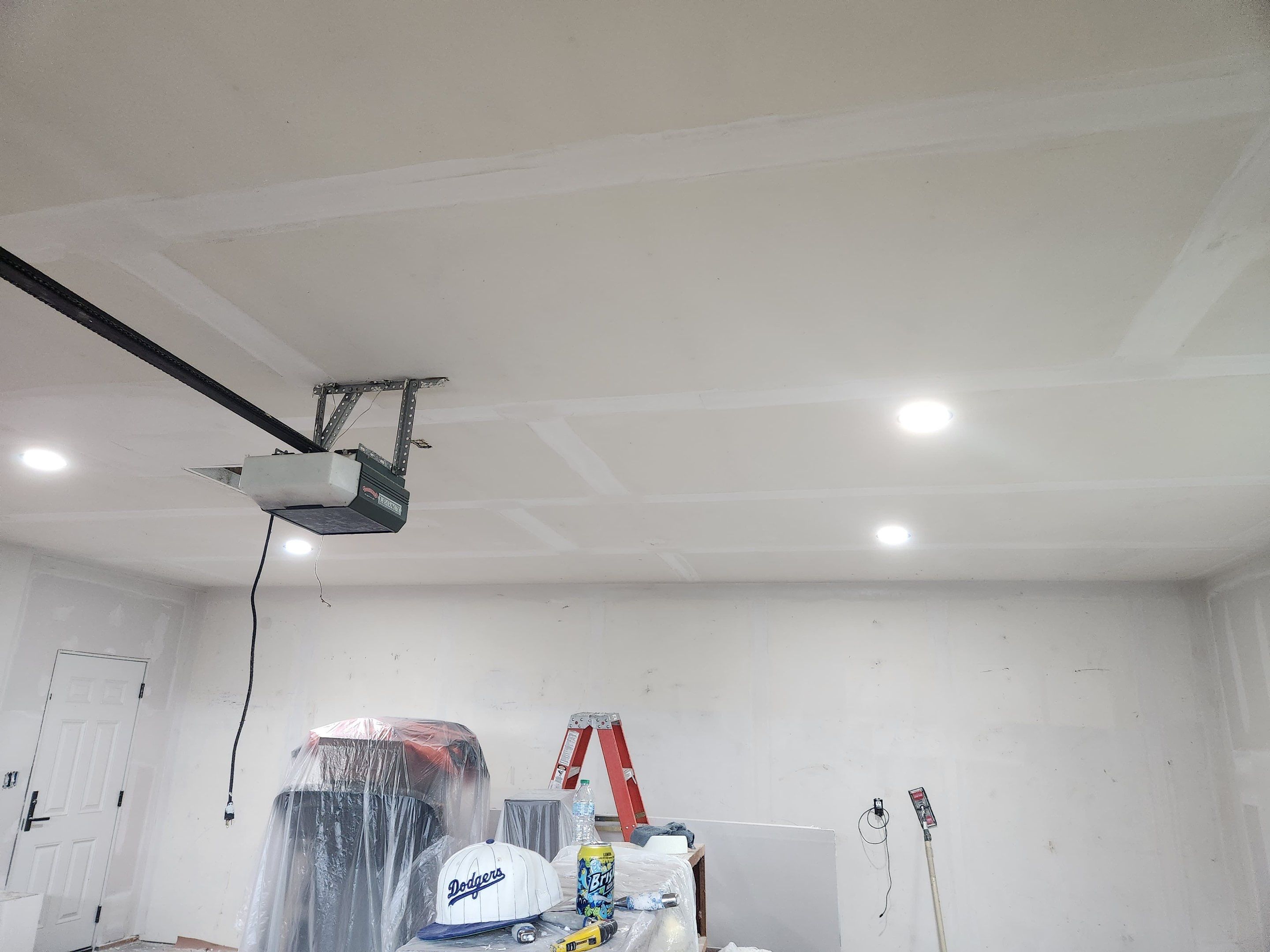 Yankton Garage Remodel with Andersen Window Installation and Drywall by Select Painting, Coatings & Garage Cabinets