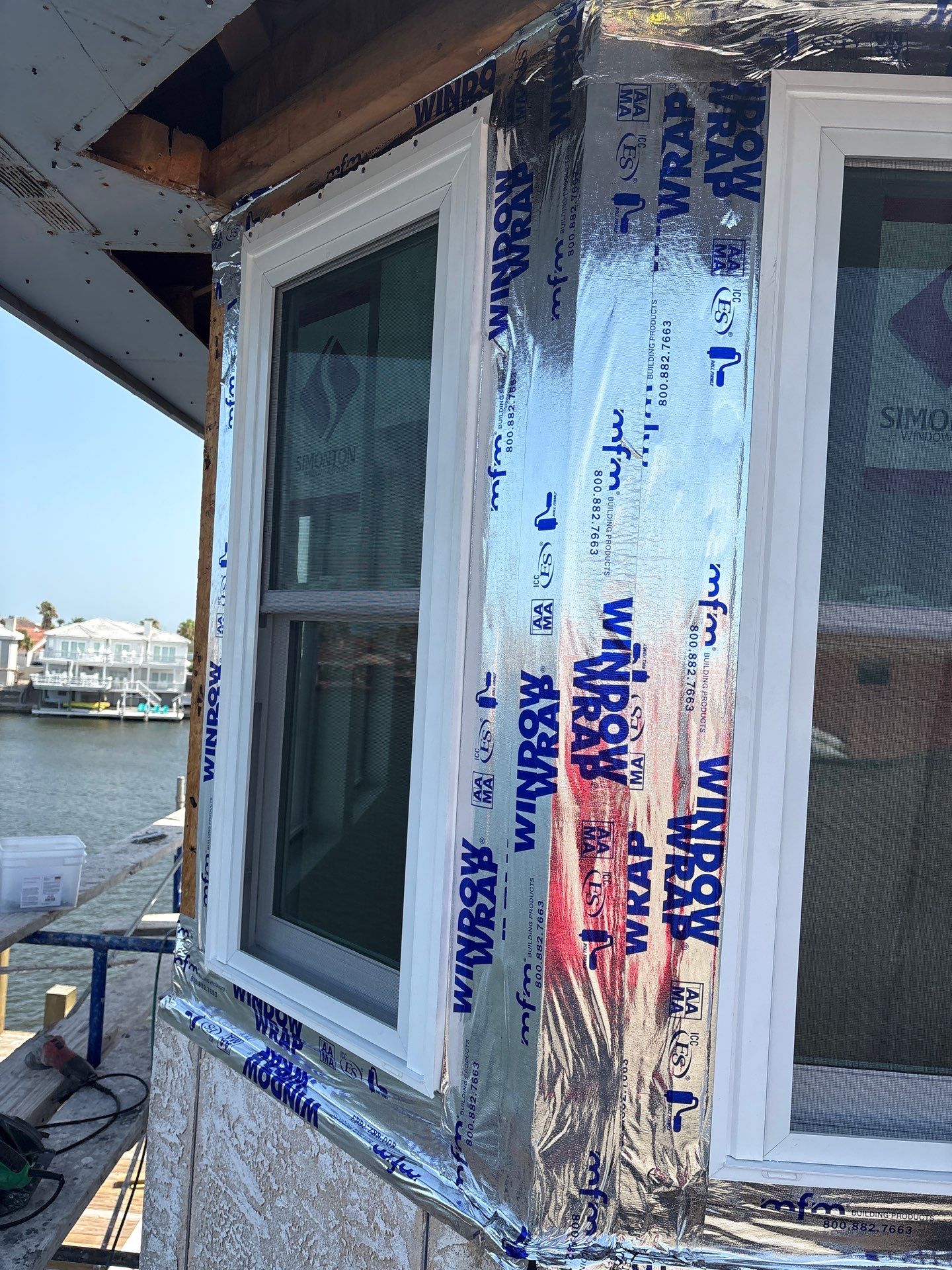 Installing Windows on a Submarine  by Bayfront Roofing and Construction