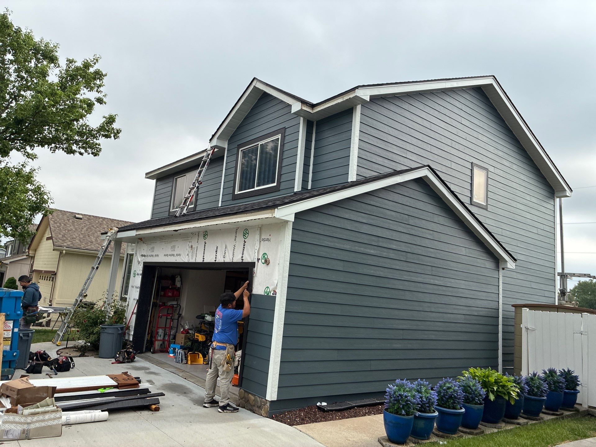 James Hardie Siding and Window Replacement with Arctic White Trim by Carps Complete Exteriors