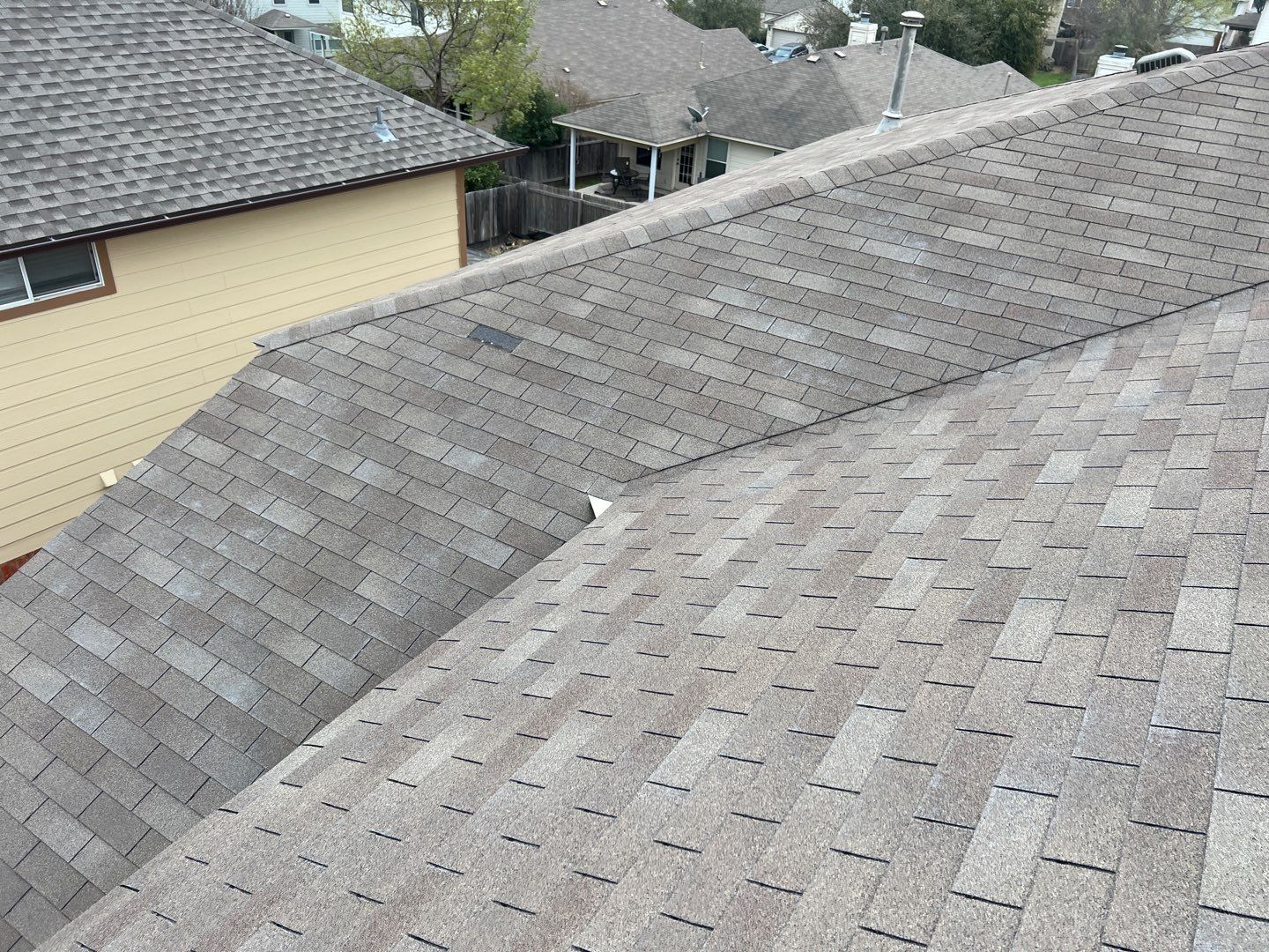 Wind damaged roof replacement by Oakwood Roofing and Construction, LLC