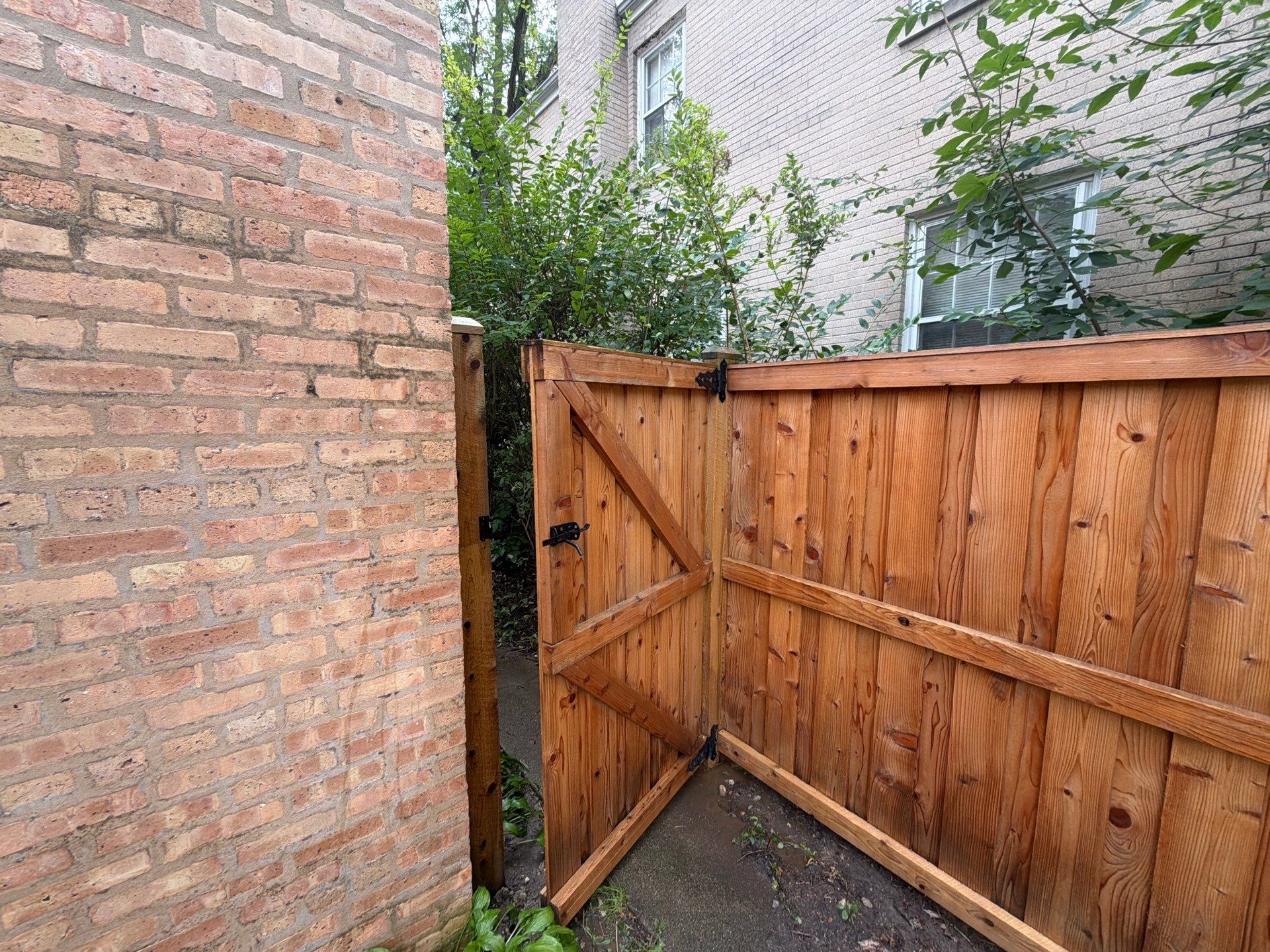 Wood fence cleaning and sealing by Northern Power Washing LLC.