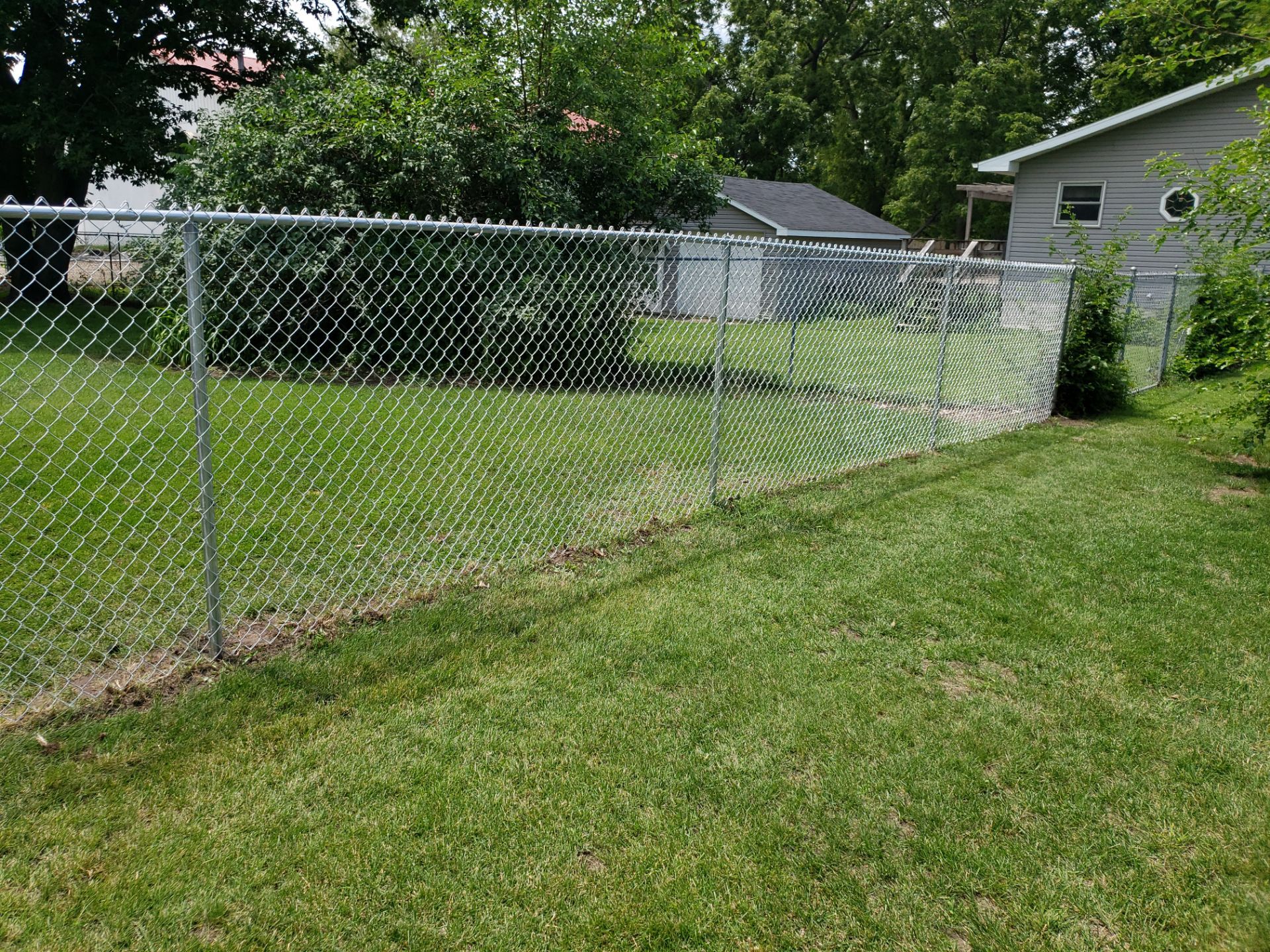 Residential Chain Link Fence and Gate Installation in Washburn by Perfect Picket Fence and Stain