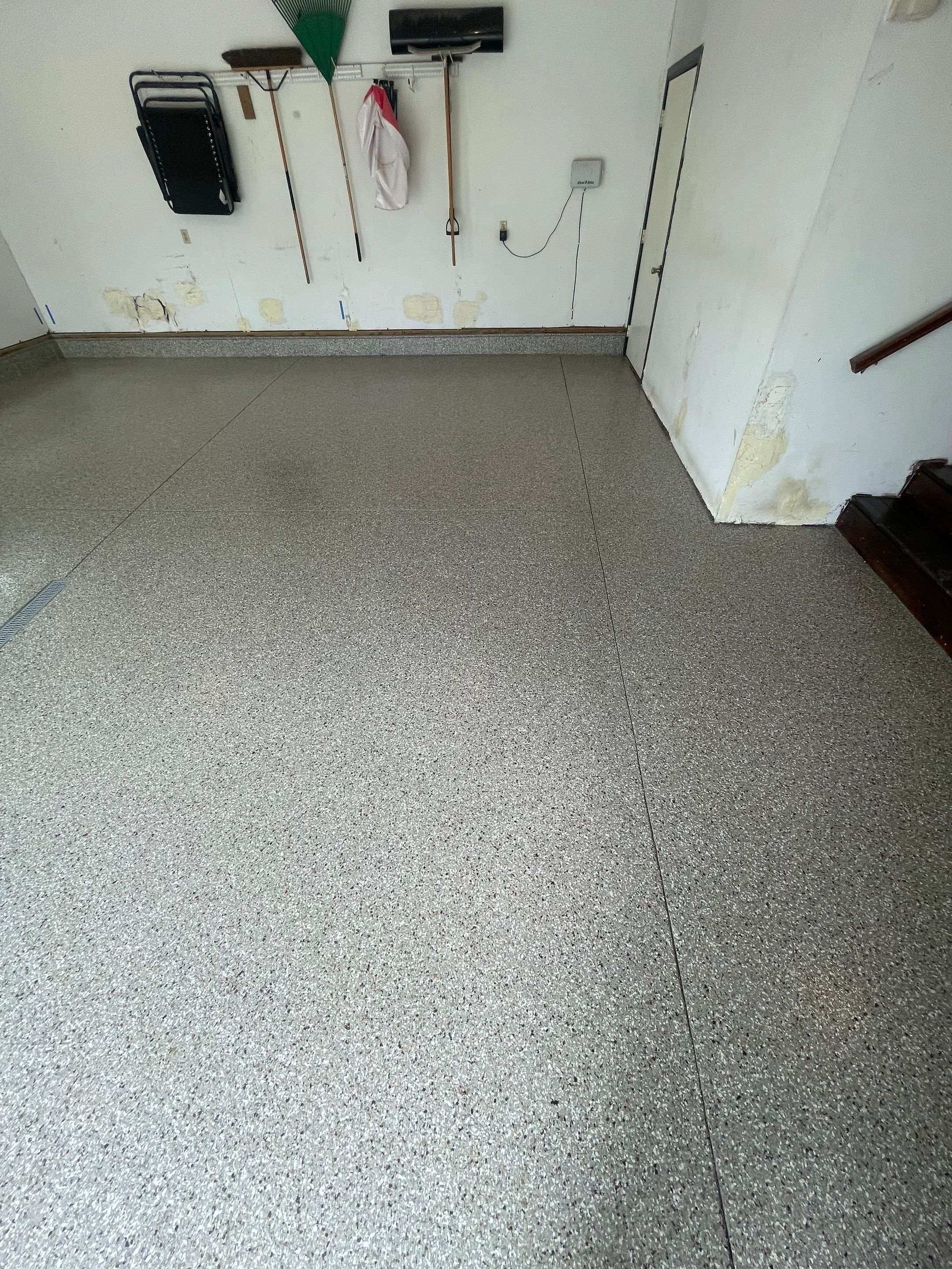Hartford Residential Garage Floor Transformation With Decorative Chip Coating by Select Painting, Coatings & Garage Cabinets