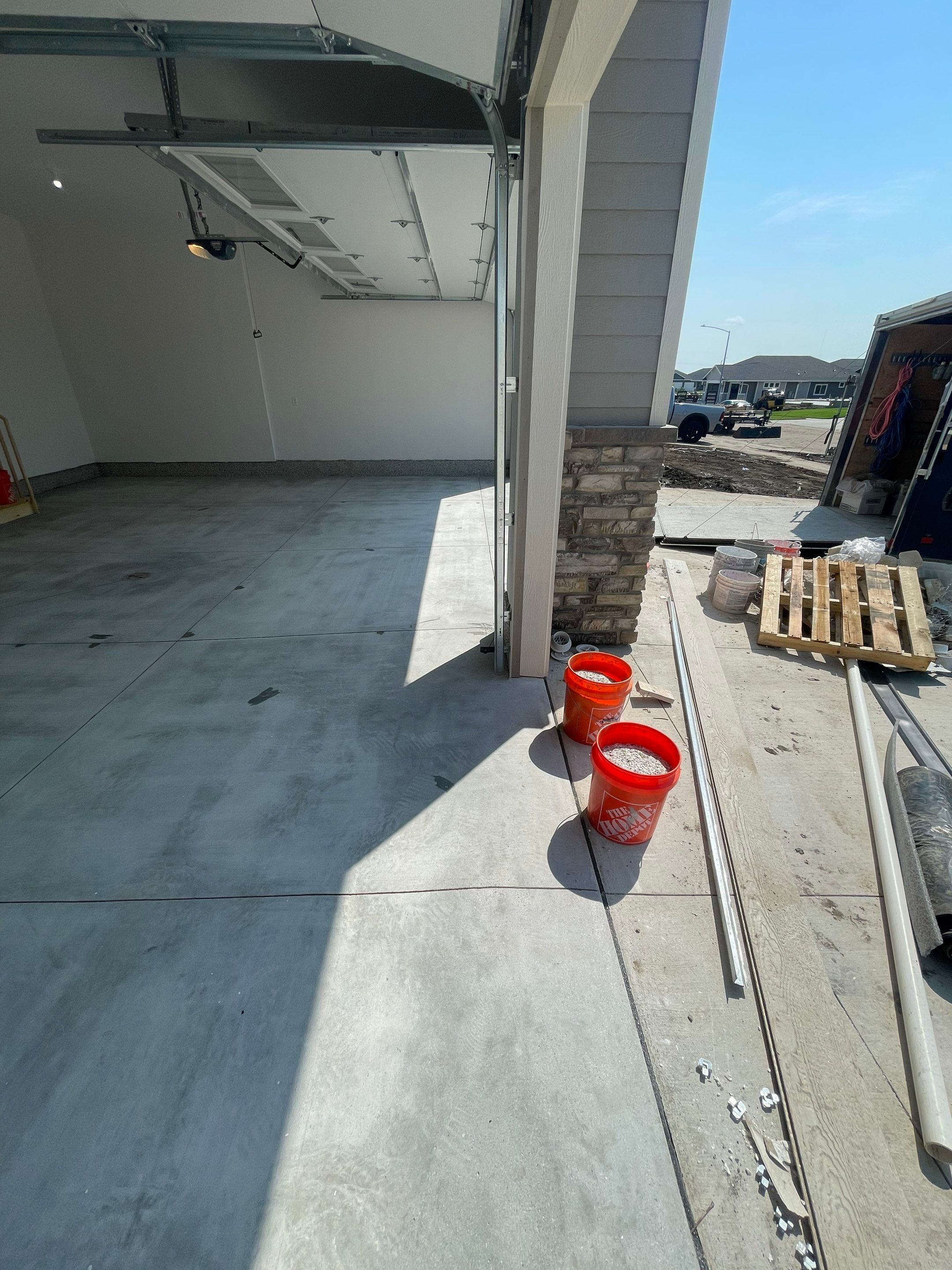 Grey Speckled Garage Floor Coating in Sioux Falls by Select Painting, Coatings & Garage Cabinets