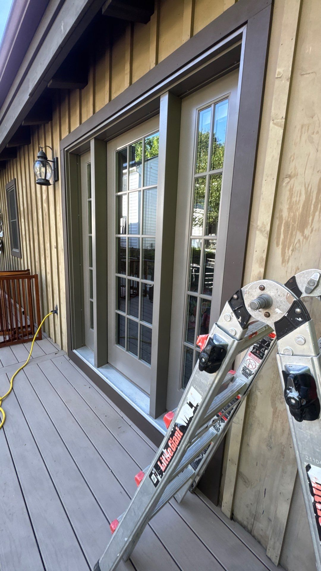 Custom Composite Deck with Stone Fireplace and Modern Cable Railing by Walnut Hollow Decks & Outdoor Living