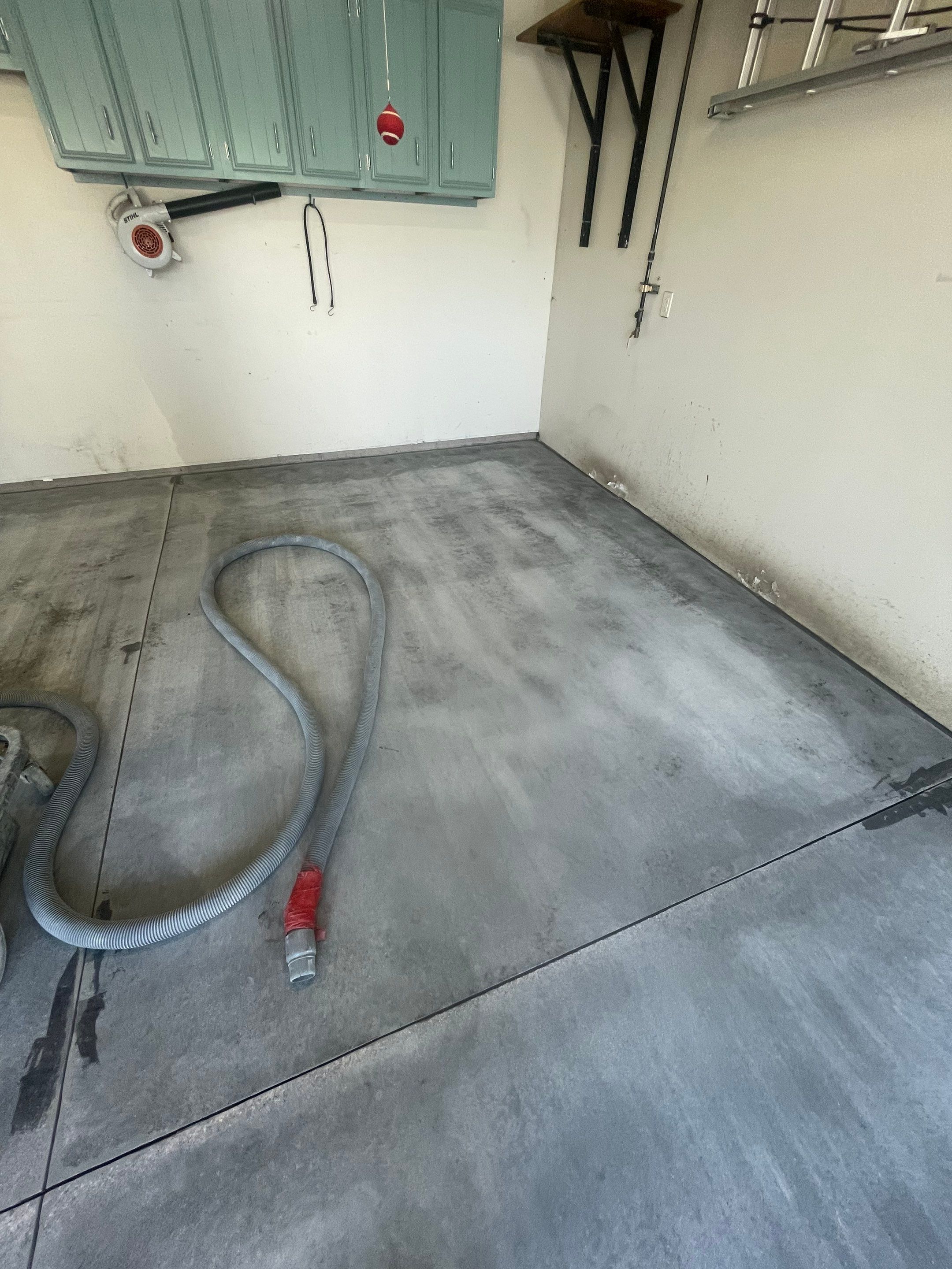 Multi-Stall Garage Floor Coating Installation in Sioux Falls by Select Painting, Coatings & Garage Cabinets