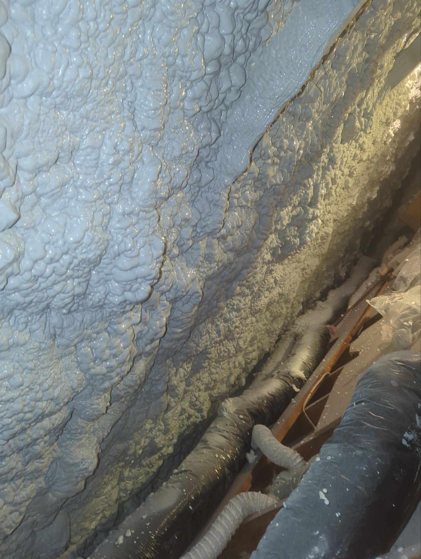 Attic Retrofit using open cell spray foam by NYS Foam & Energy