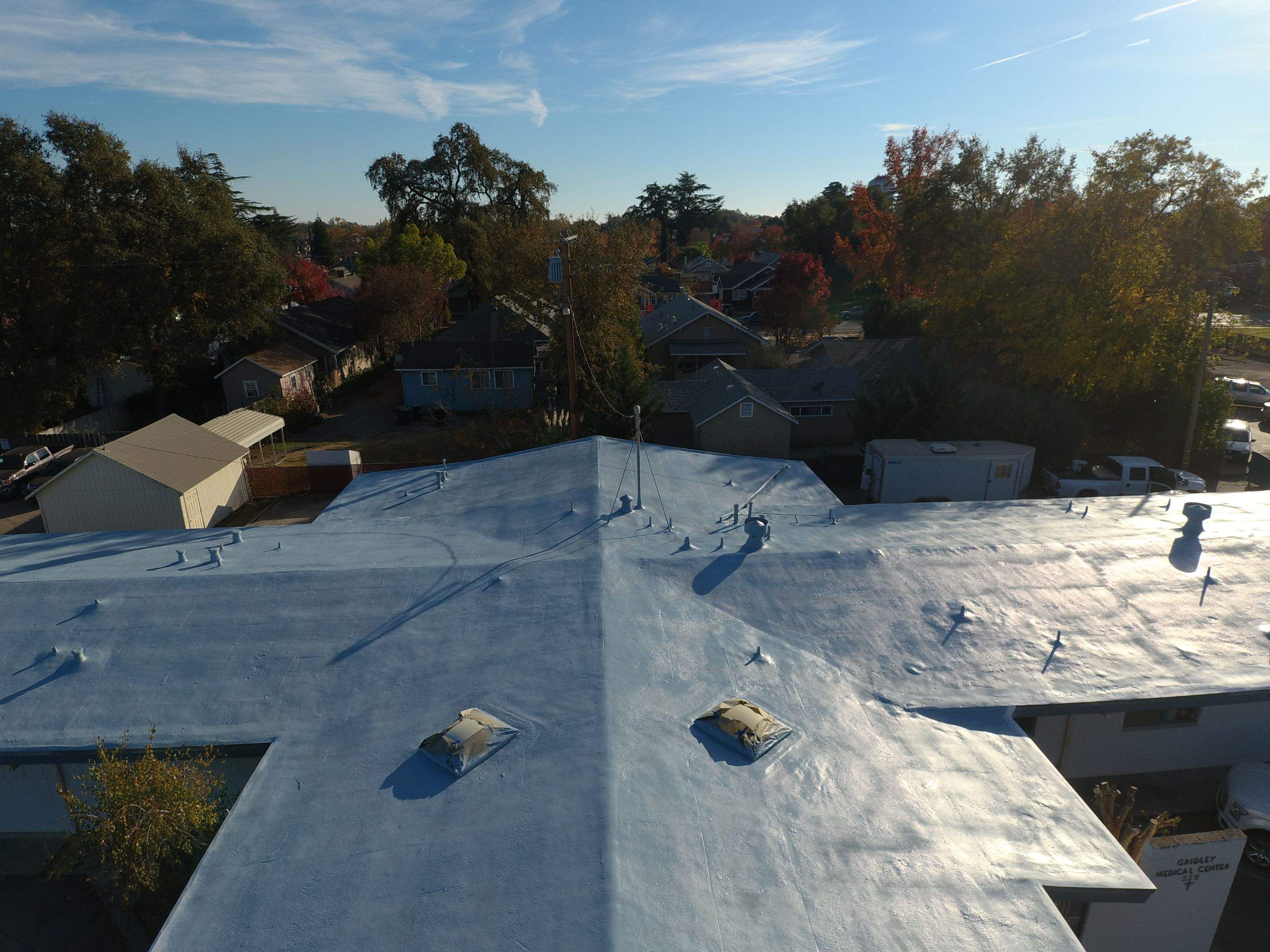Spray foam and coatings using Conklin Benchmark/PUMA XL coatings and spray foam by Straight Edge Roofing Inc