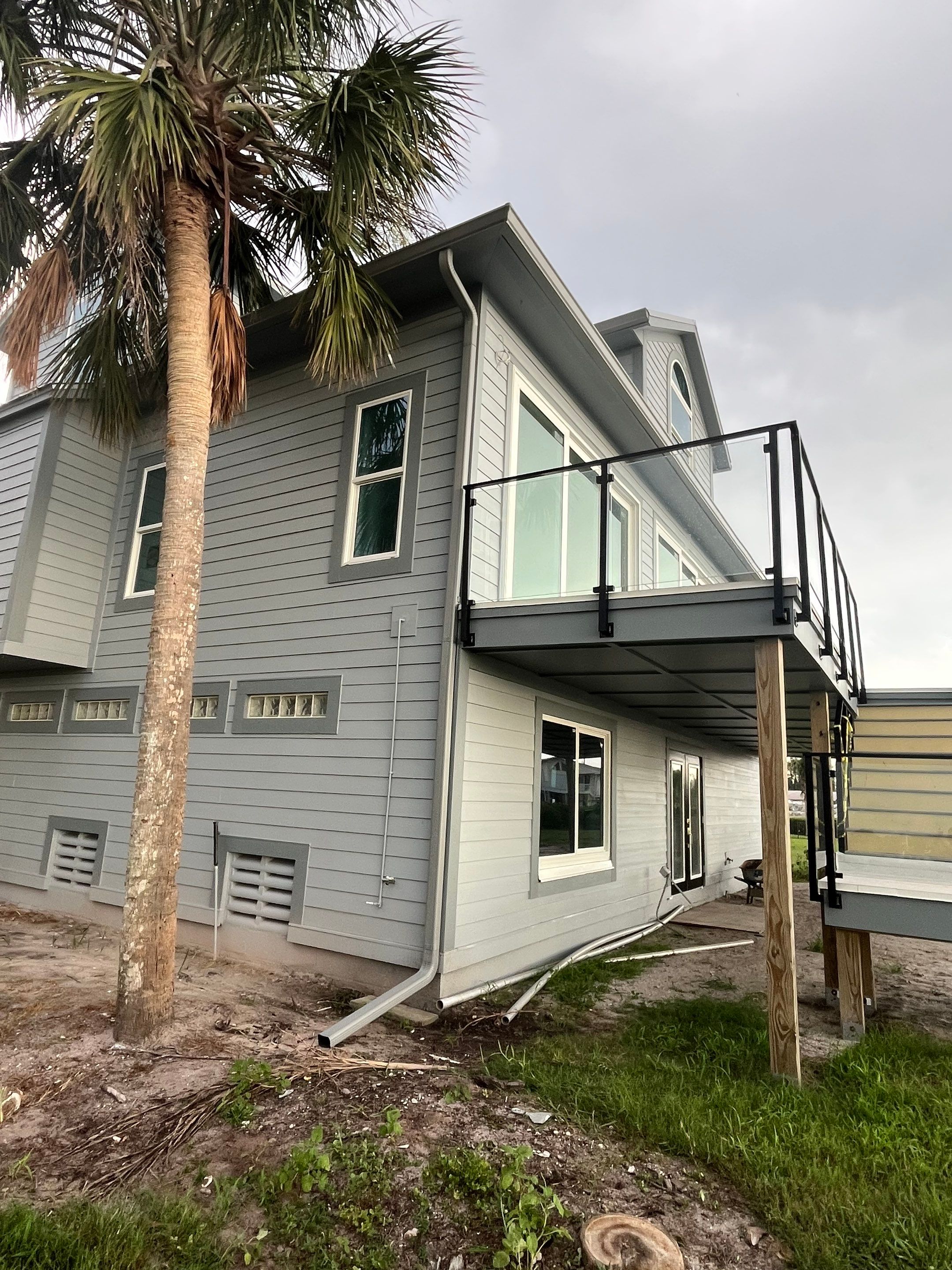 Downspout Installation Dove Grey Palmetto FL by Gutter Professors