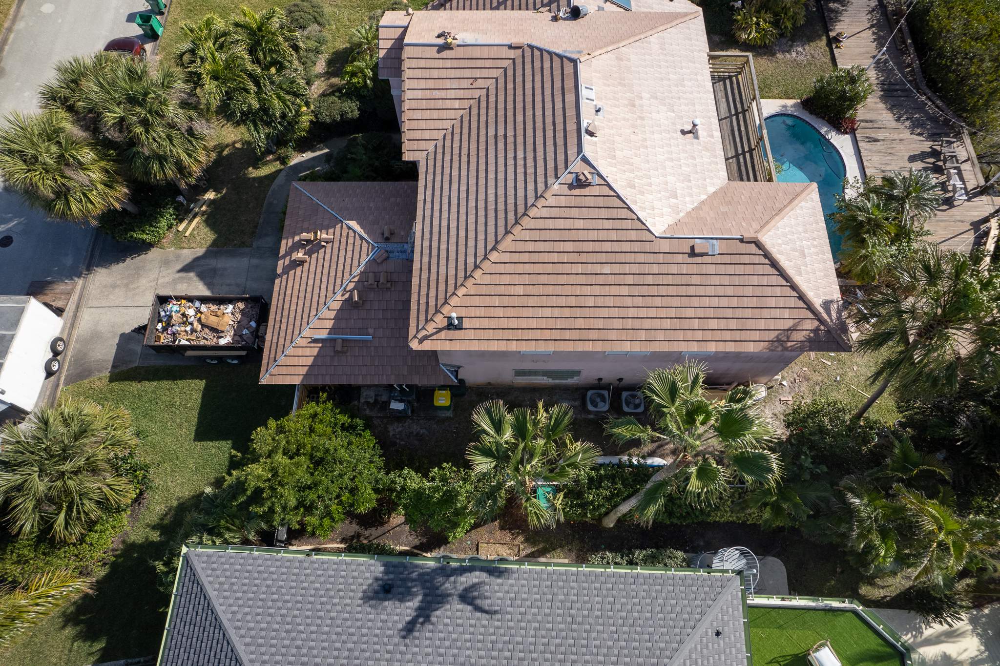 Full Clay Tile Roof Replacement and Deck Repair in Cocoa Beach, Florida by Wiedmann Construction & Roofing