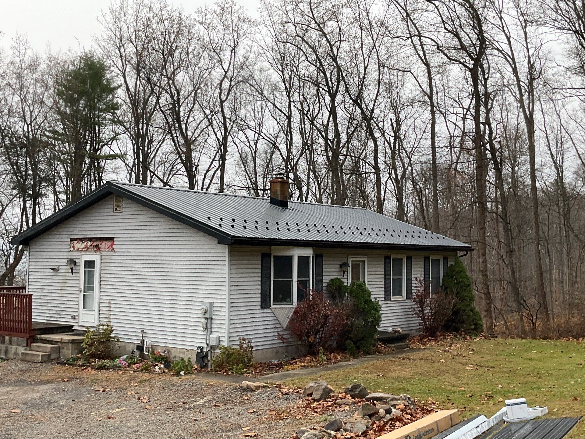 Dalmatia Metal Roofing and Custom Timber Entry Portico by Esh Builders
