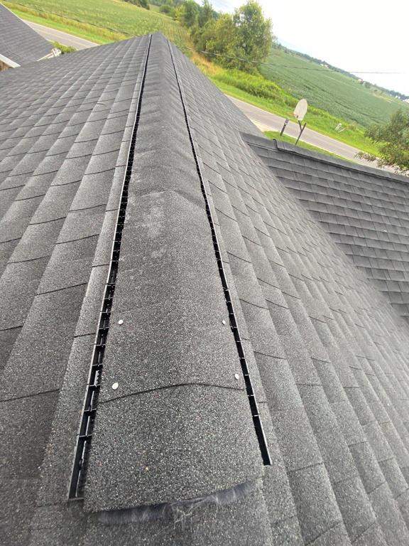 Storm damage roof replacement by Nitro Roofing and Construction