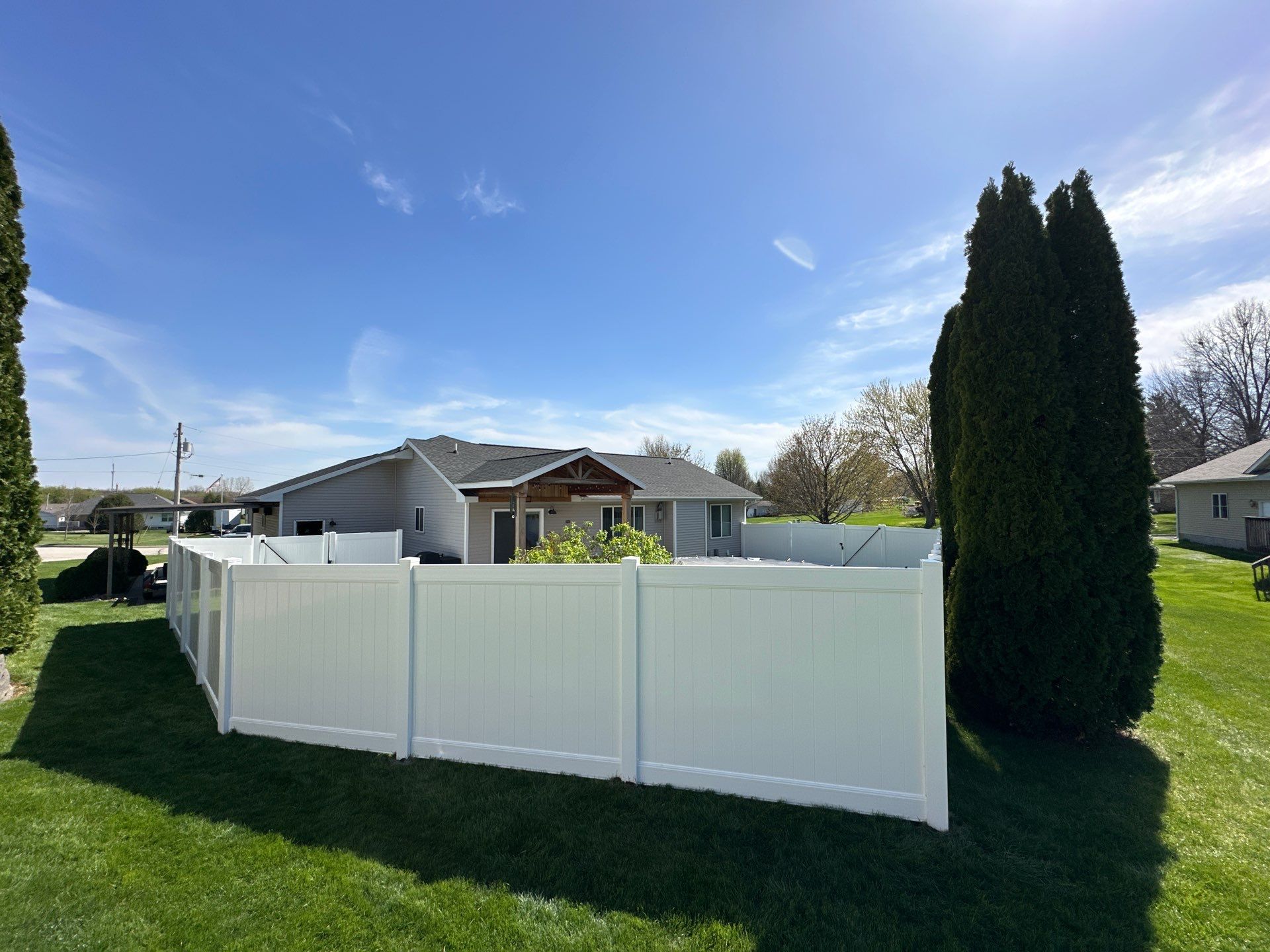 White Vinyl Privacy Fence Installation in Raymond, Iowa by Perfect Picket Fence and Stain