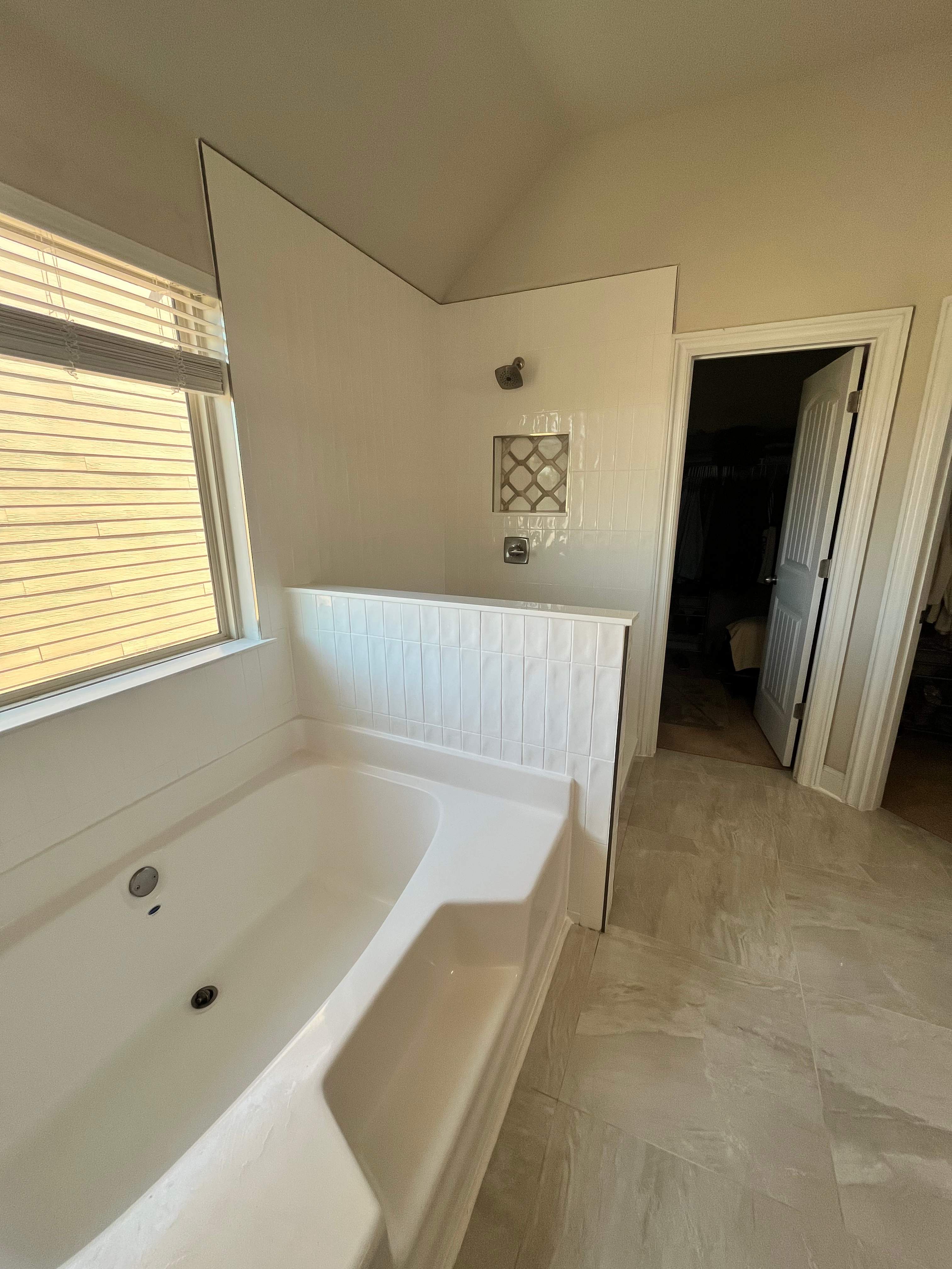 Shower retile and bathroom flooring by Prudencio