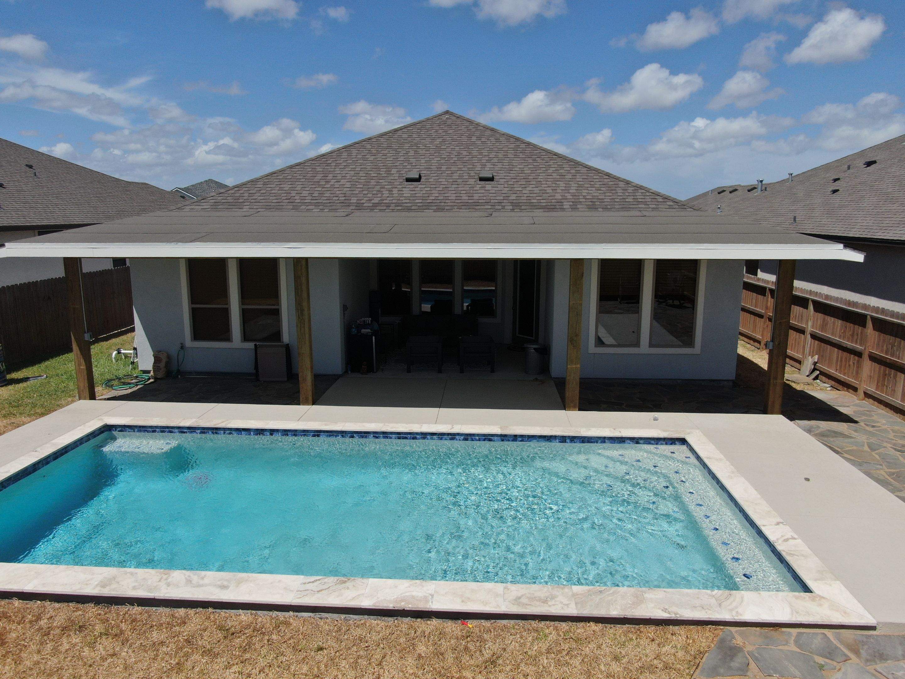 Patio Pool Cover by Bayfront Roofing and Construction