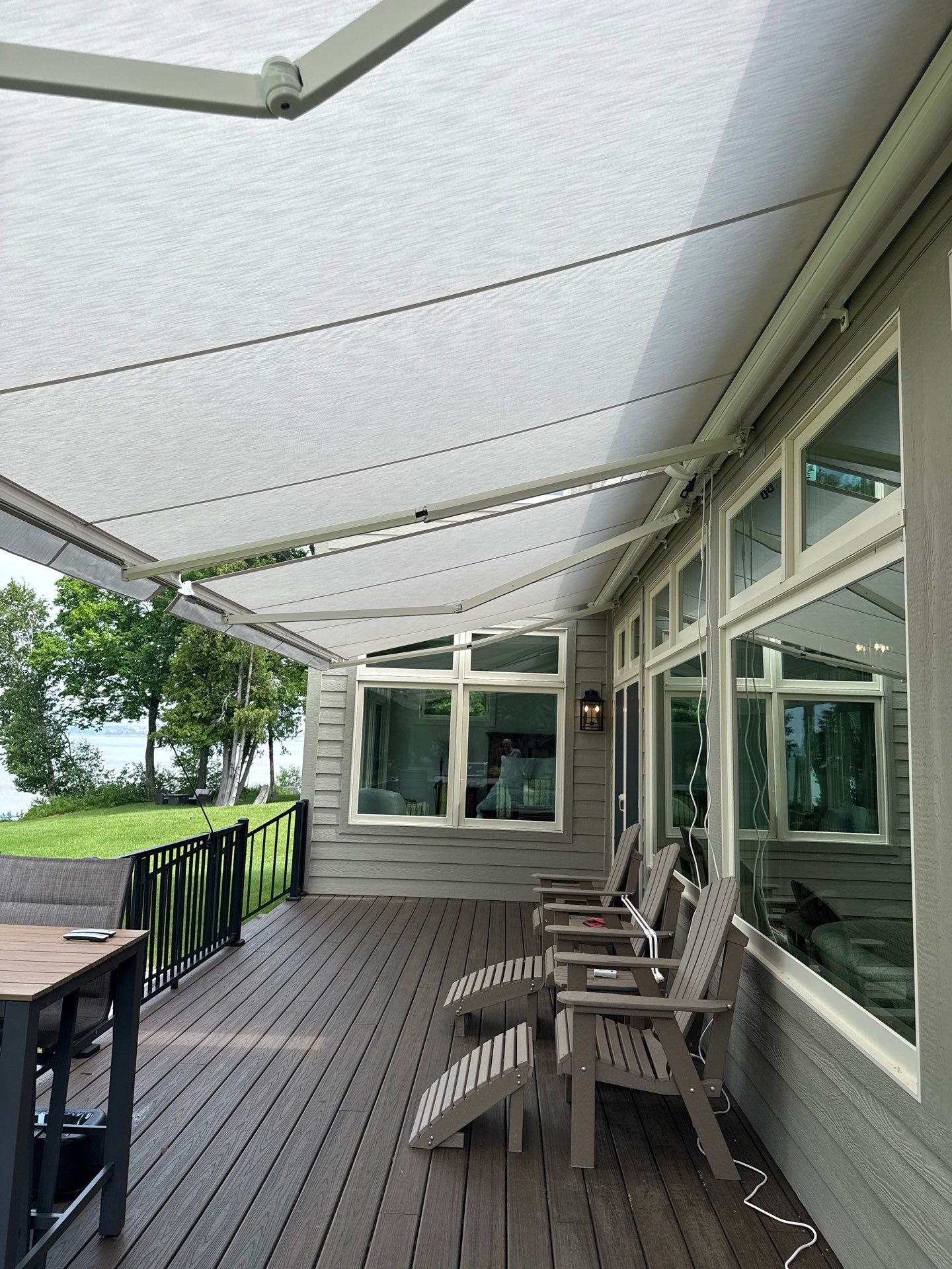Sunesta Retractable Awning Installation for Sault Sainte Marie Lakeside Deck by Rainbow Seamless Systems