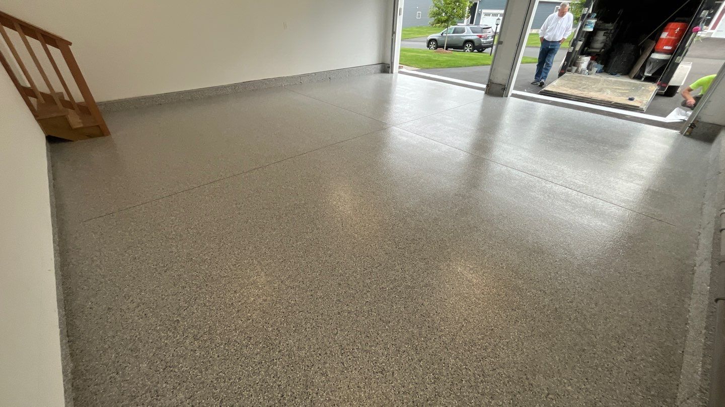 Garage in Londonderry, NH 03053 by Symphony Concrete Coatings