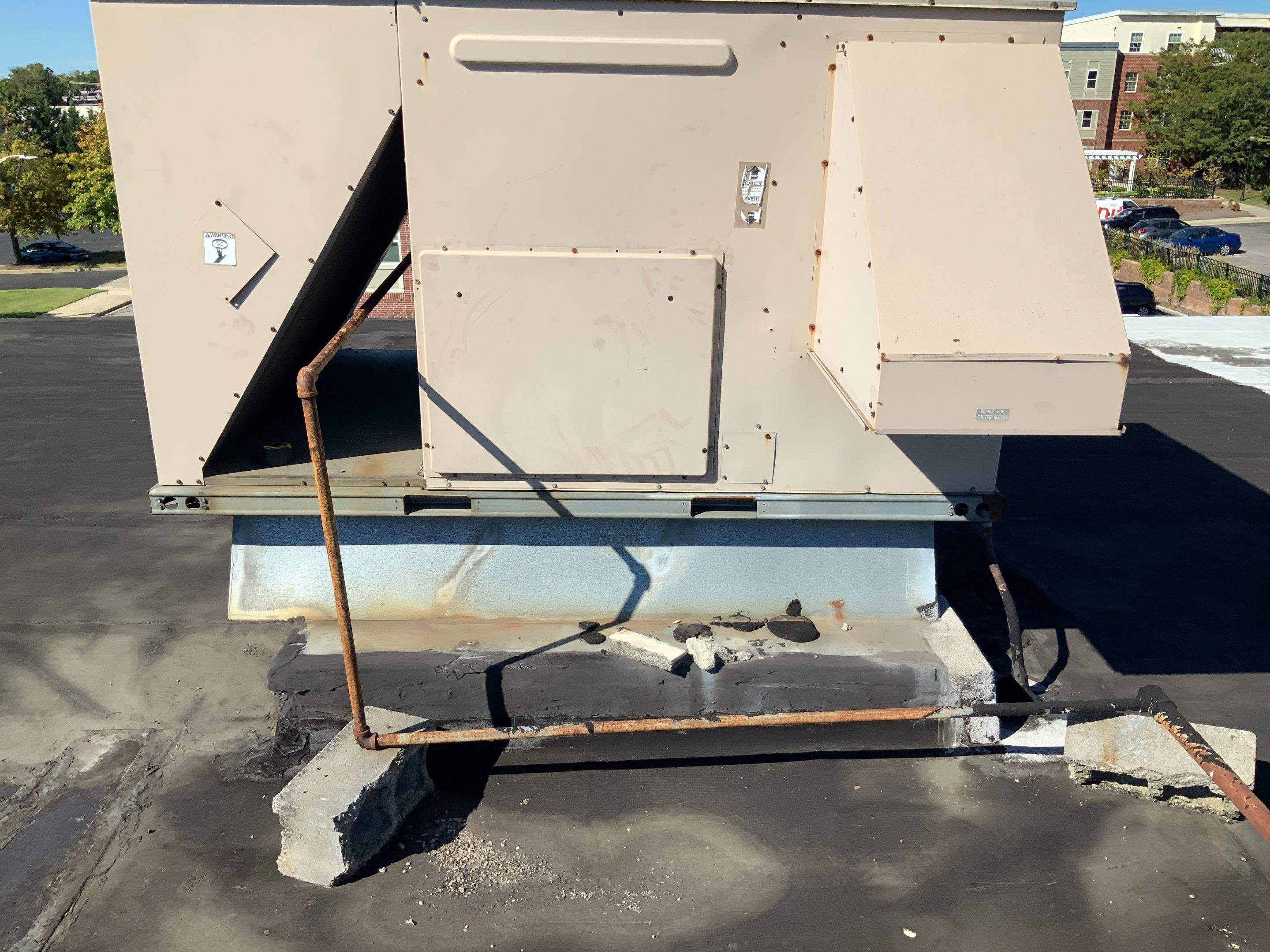 Commercial Roofing Repair using new Flashing by Alpha Design Services
