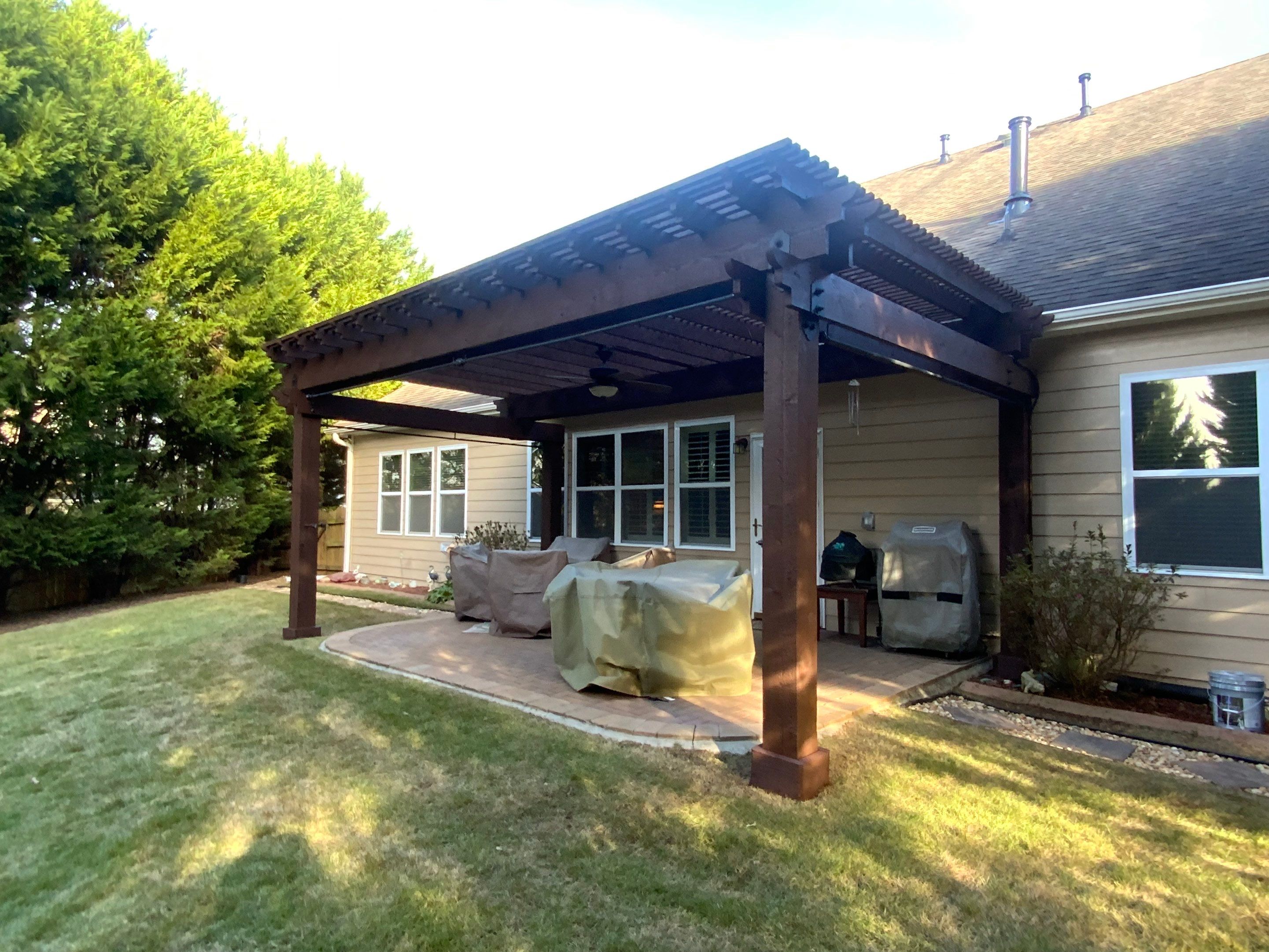Exterior Painting and Pergola Staining for Woodstock Residence by Swift Home Renovations