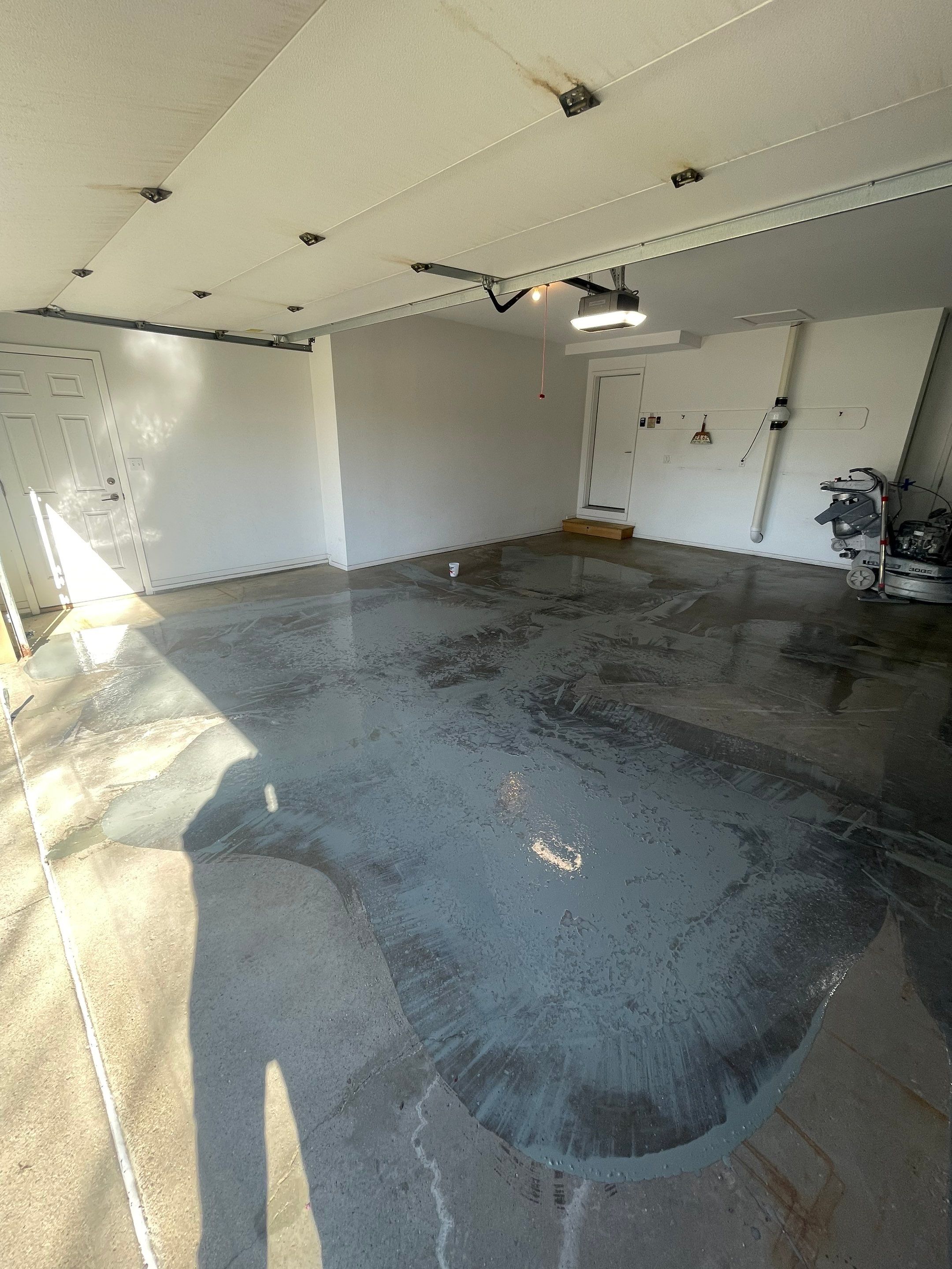 Yankton Garage Floor Restoration with Gray Speckled Epoxy Coating by Select Painting, Coatings & Garage Cabinets