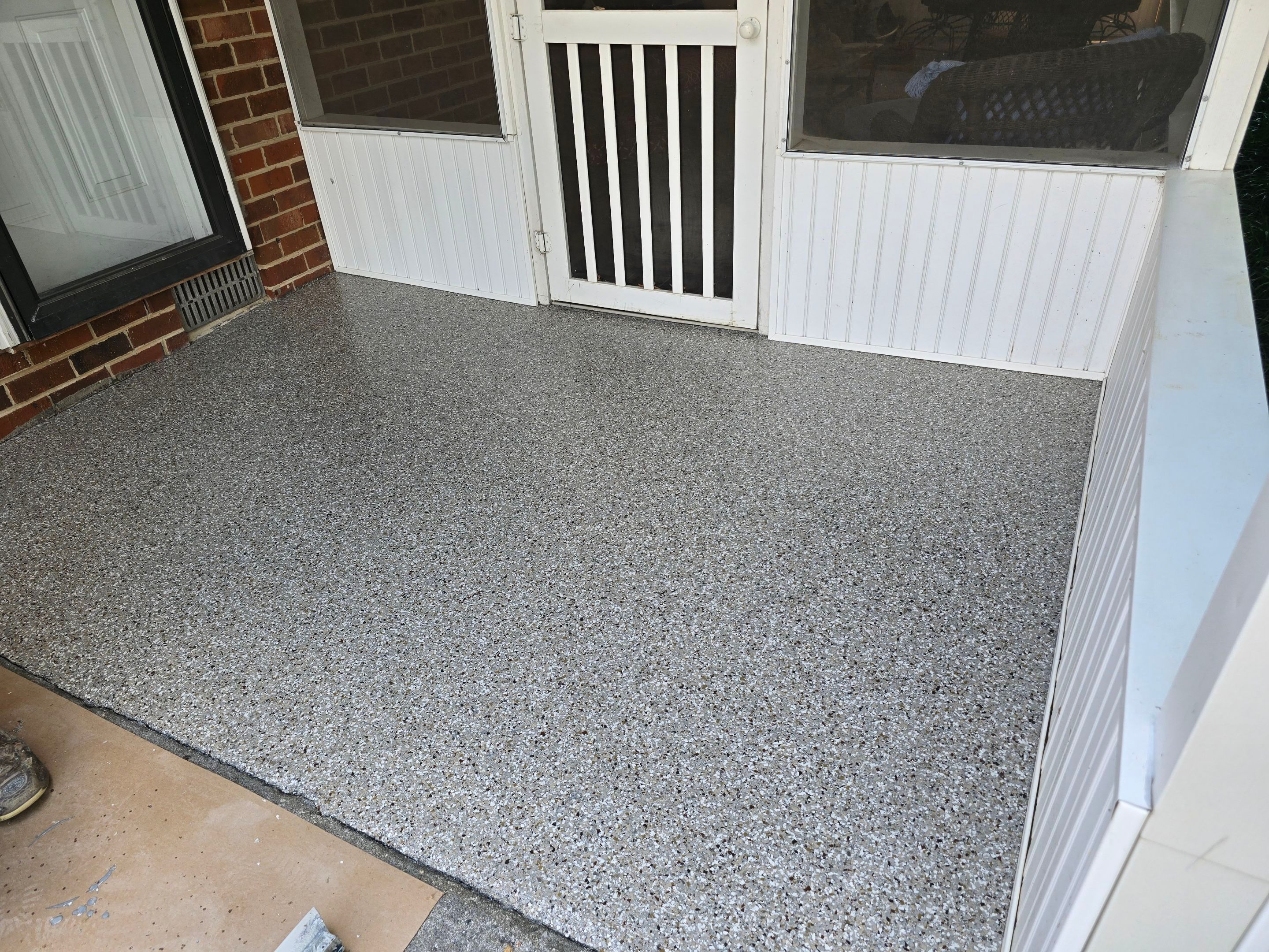 Front Porch & Garage Using Creekbed by Elite Floor Solutions