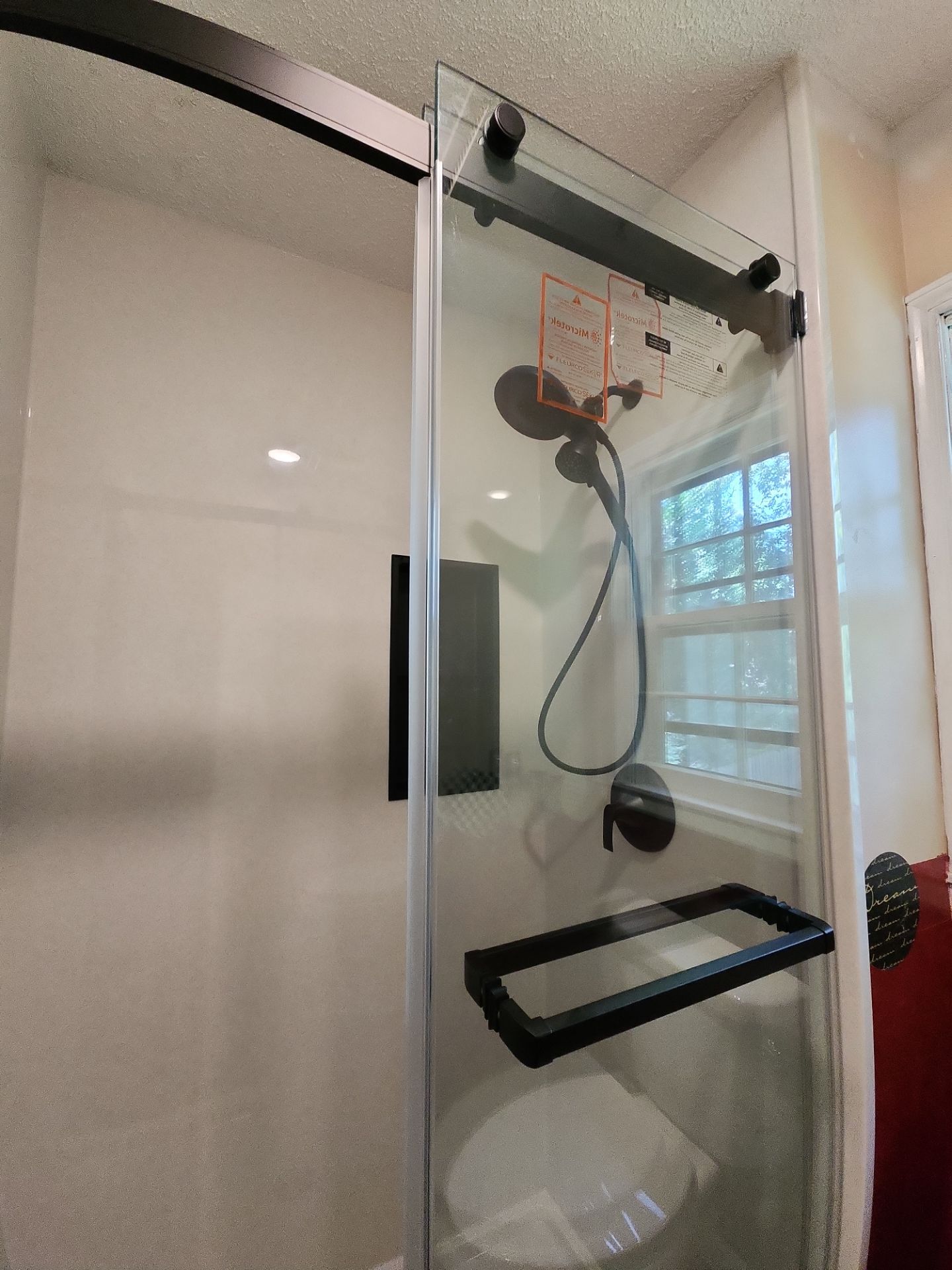 Bathroom Remodel using Tile Floor by The Shower Company