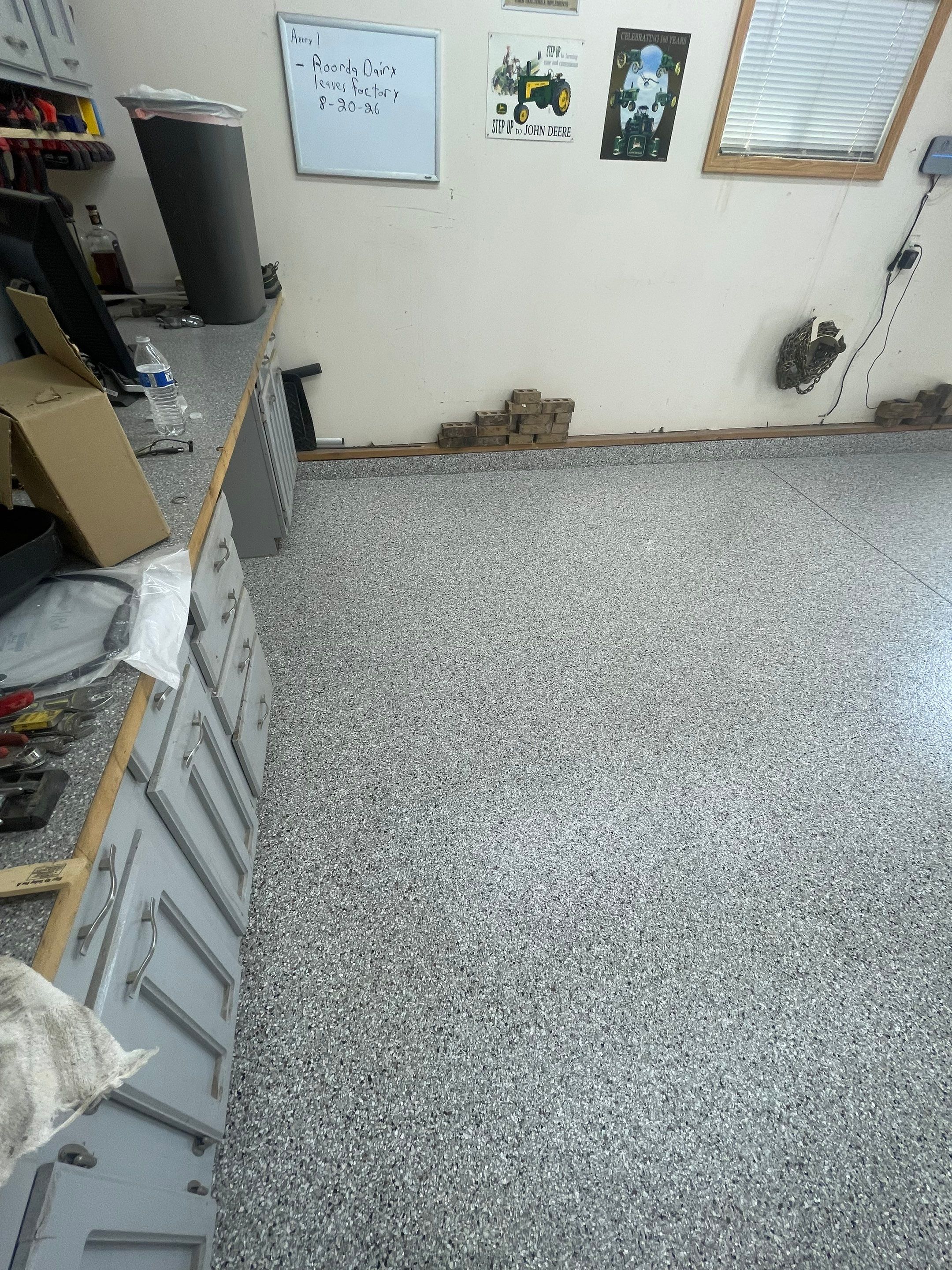 Multi-Stall Garage Floor Coating Installation in Sioux Falls by Select Painting, Coatings & Garage Cabinets