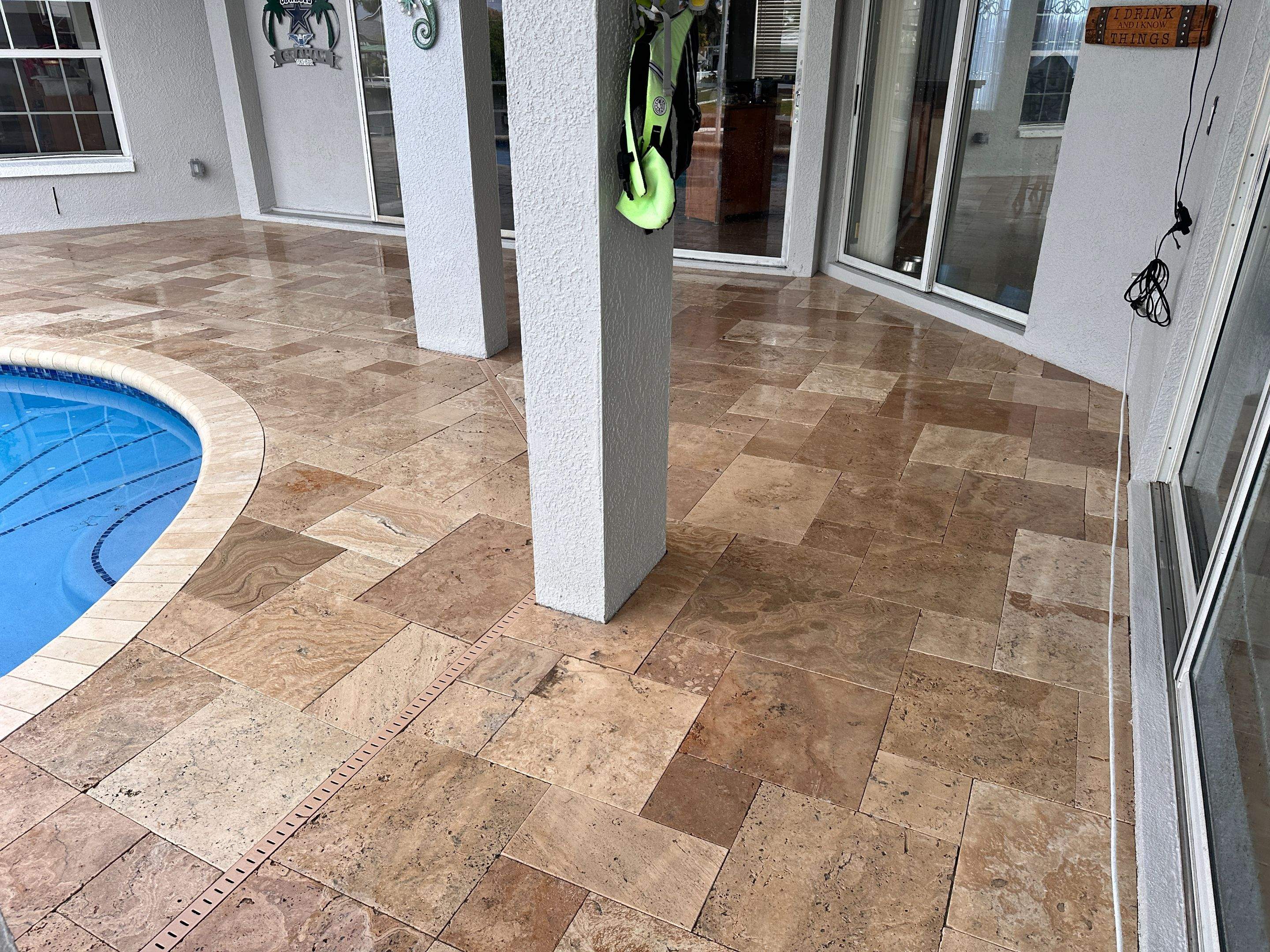 Travertine Sealing and Stripping for a Waterfront Pool Deck in Apollo Beach by Supreme Paver Experts