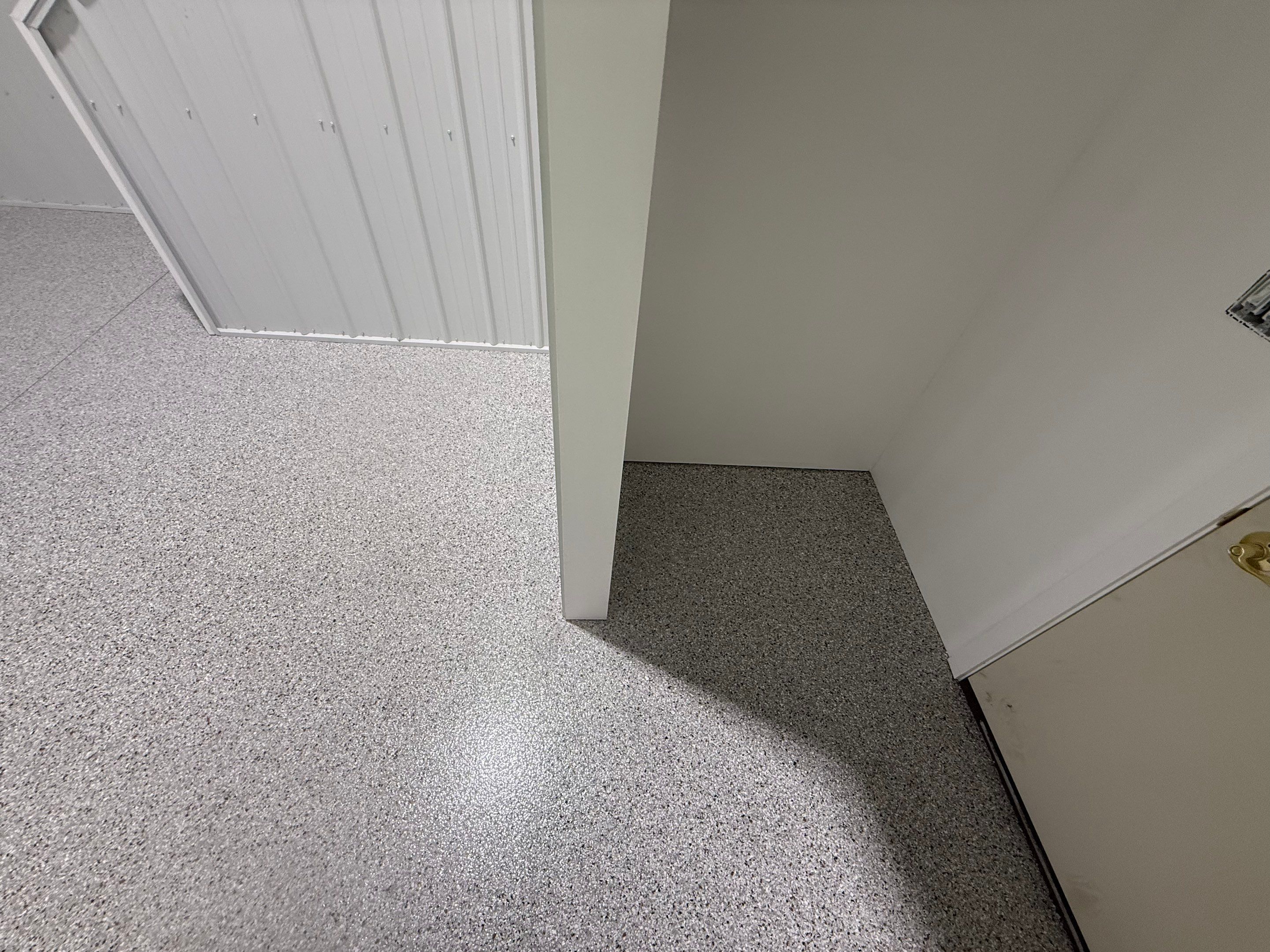 Custom Speckled Floor Coating for Large Montrose Shop by Select Painting, Coatings & Garage Cabinets