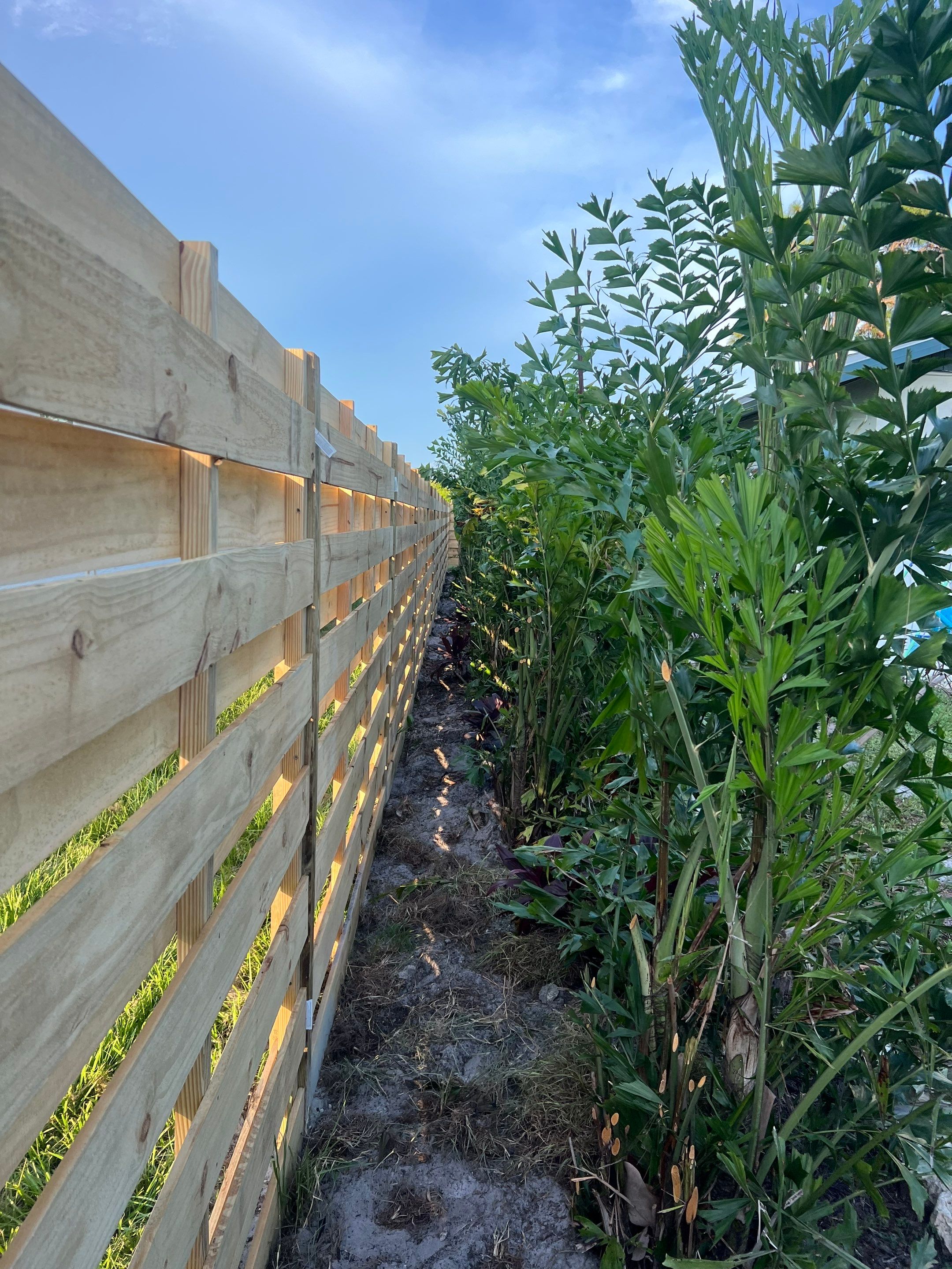Wood Fence Installation using Horizontal Shadowbox Wood Privacy Fence by Asap fence and gates, LLC