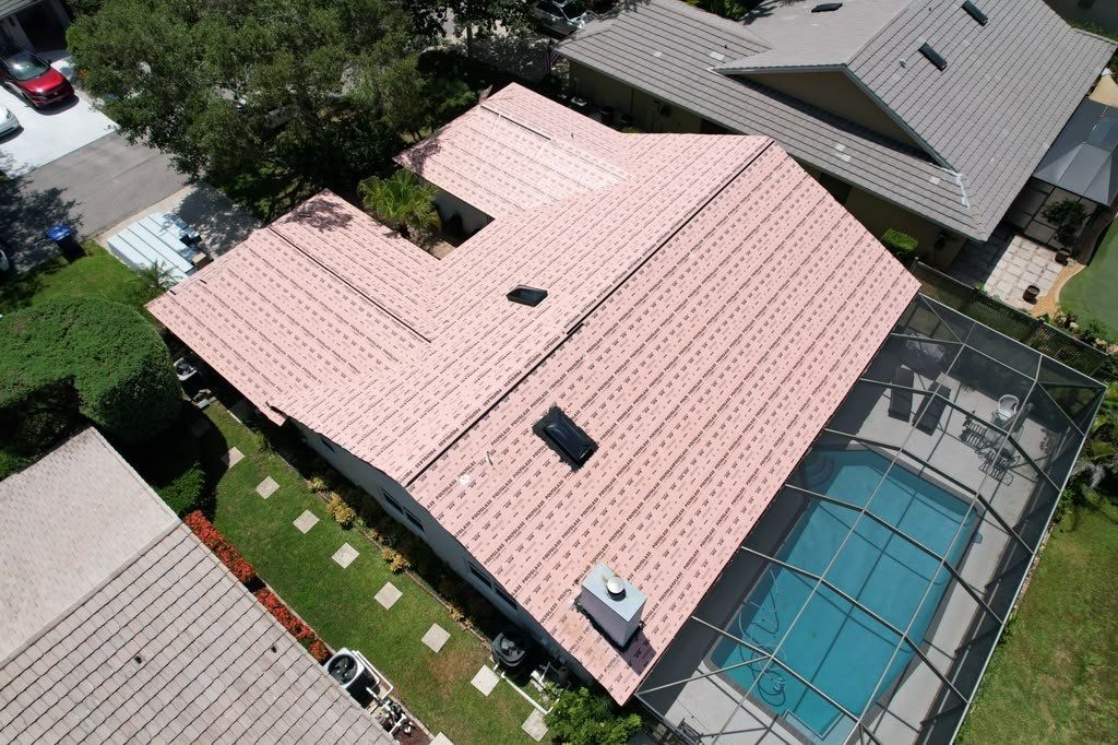 Standing Seam Metal Charcoal Grey Roof Replacement and Skylight Installation in Jupiter by Art's Roofing & Construction