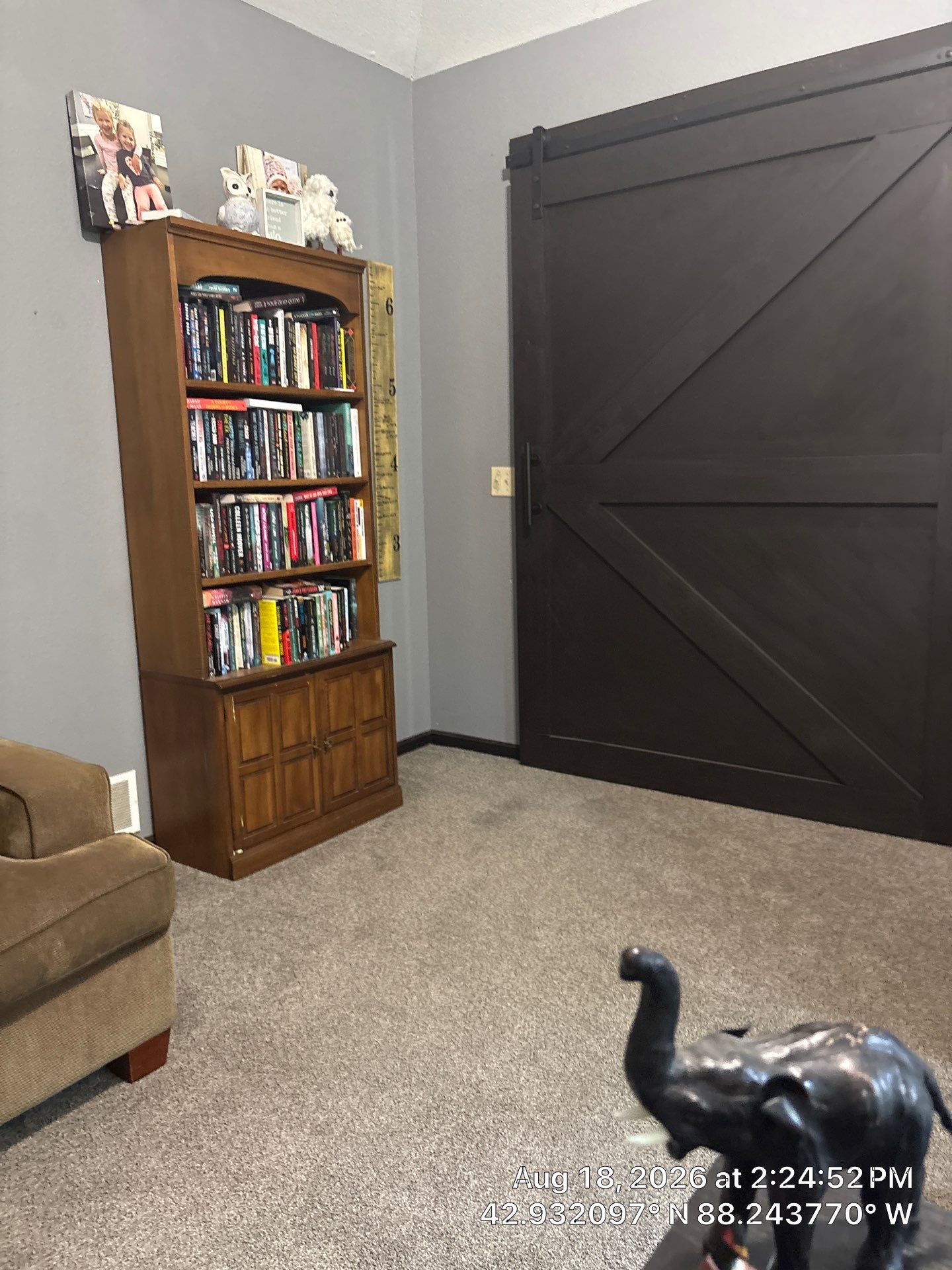 Custom Dark Wood Sliding Barn Door Installation in Waukesha by CompanyCam Sales Demo
