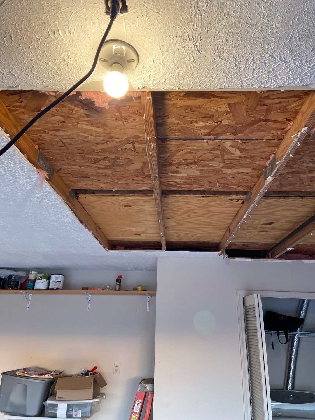 Interior Water Damage Affecting the Garage and Kitchen  by ANR Restoration