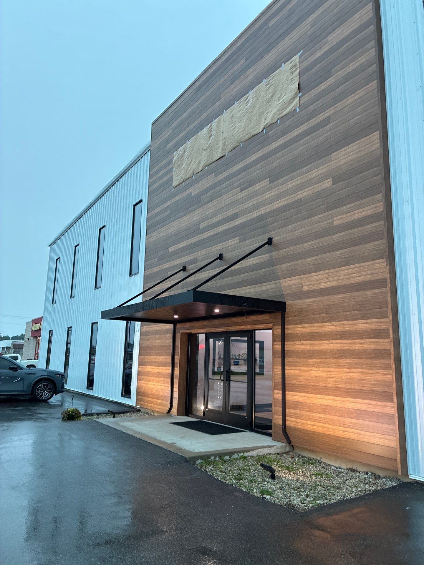 Custom Cabnova Metal Lettering and Wood-Look Panel Installation in Bremen by Hayes Design co