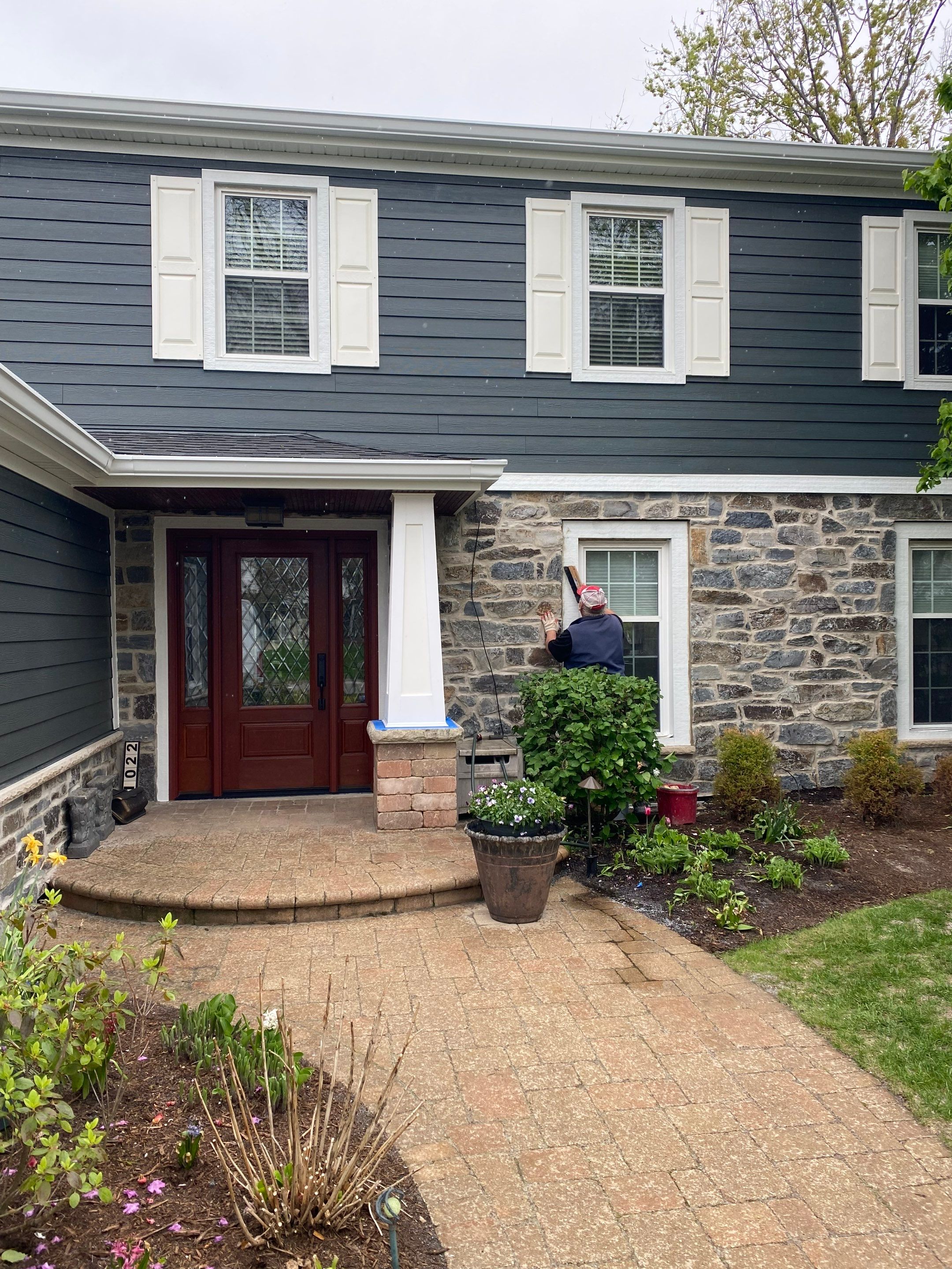 Exterior Renovation with James Hardie Siding and Natural Stone in Lombard by Great American Exteriors