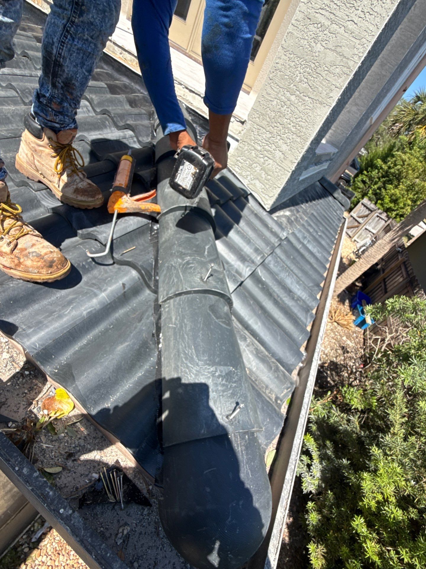 Flagler Beach Residential Tile Roof Replacement with Dark Barrel Tiles by Fortified Roofing Solutions Corp.