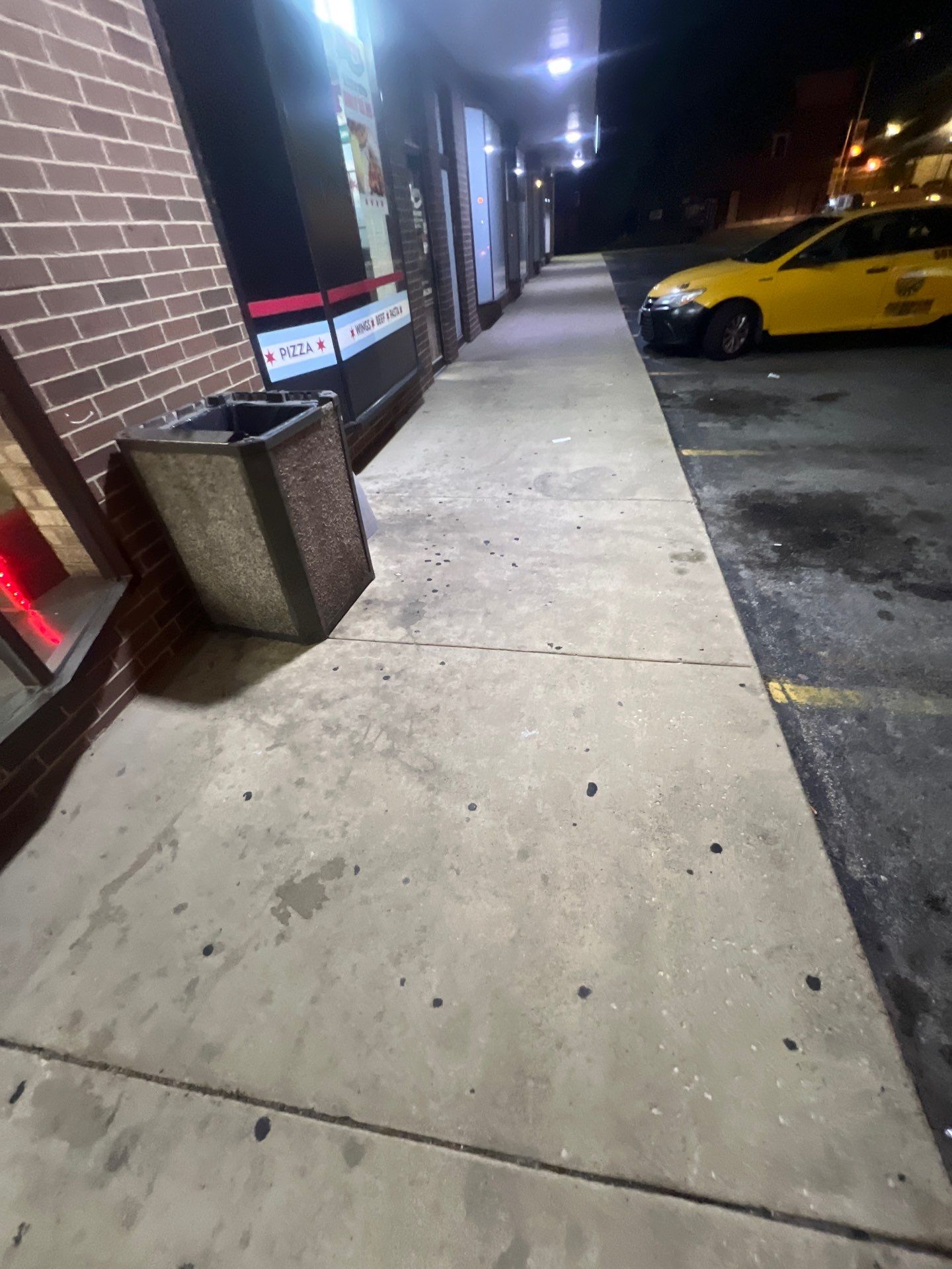 Commercial sidewalk cleaning. by Northern Power Washing LLC.