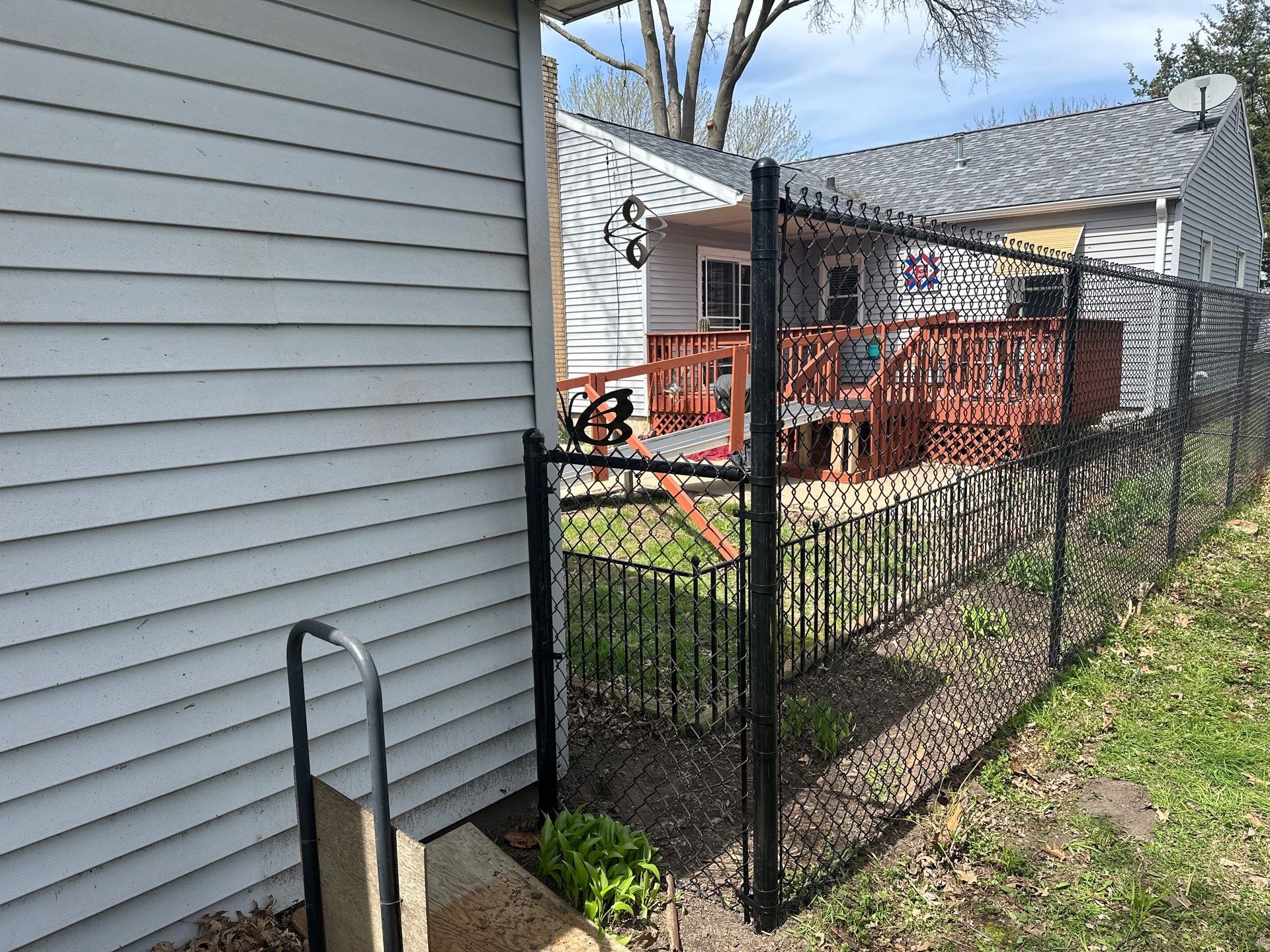 Black Chain Link Fence Installation for Waterloo Residential Backyard by Perfect Picket Fence and Stain