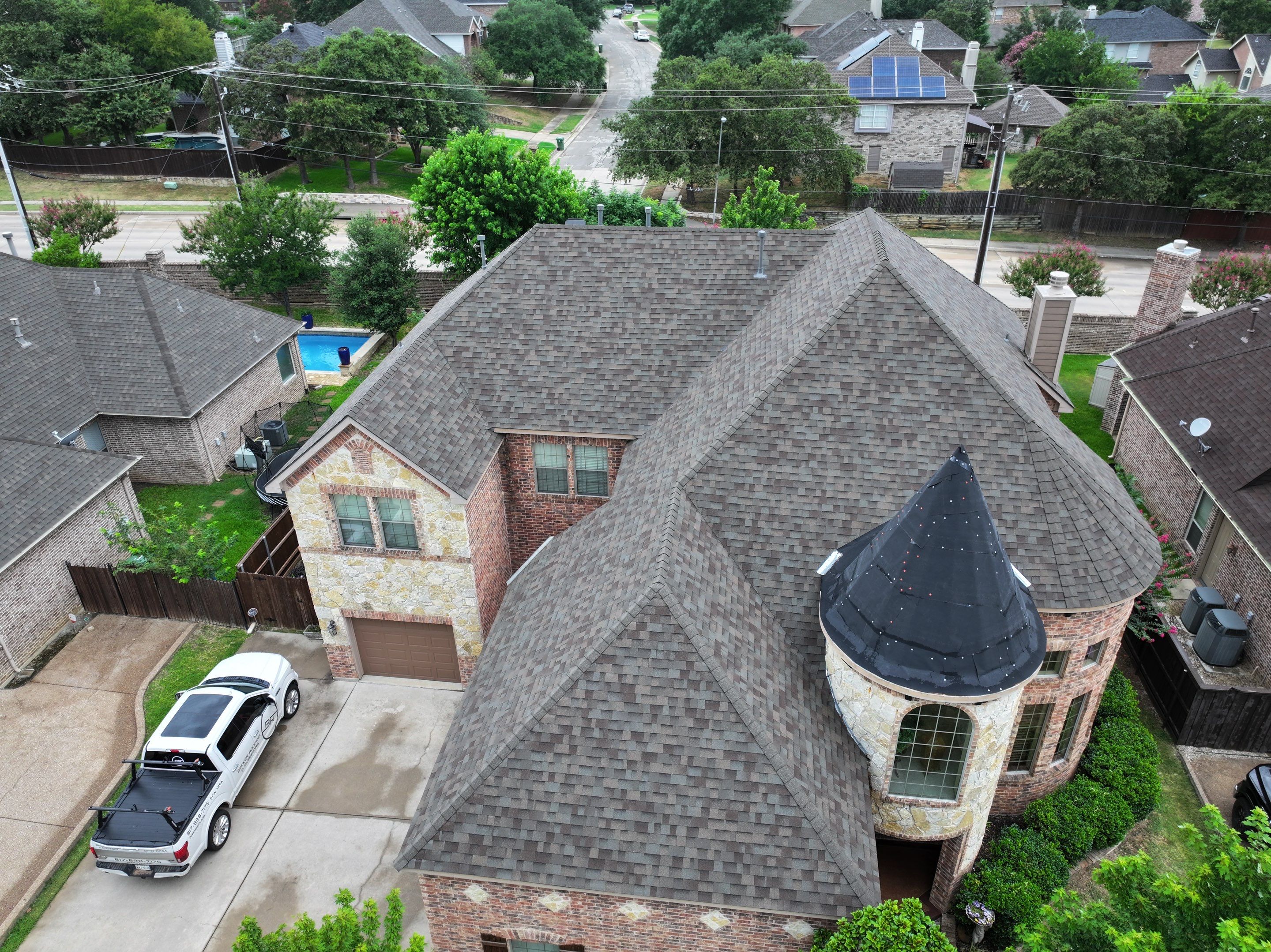 Installing Custom copper turret and Malarkey Vista Class 4 shingles Hail Damage Upgrade by Becker Roofing and Exteriors