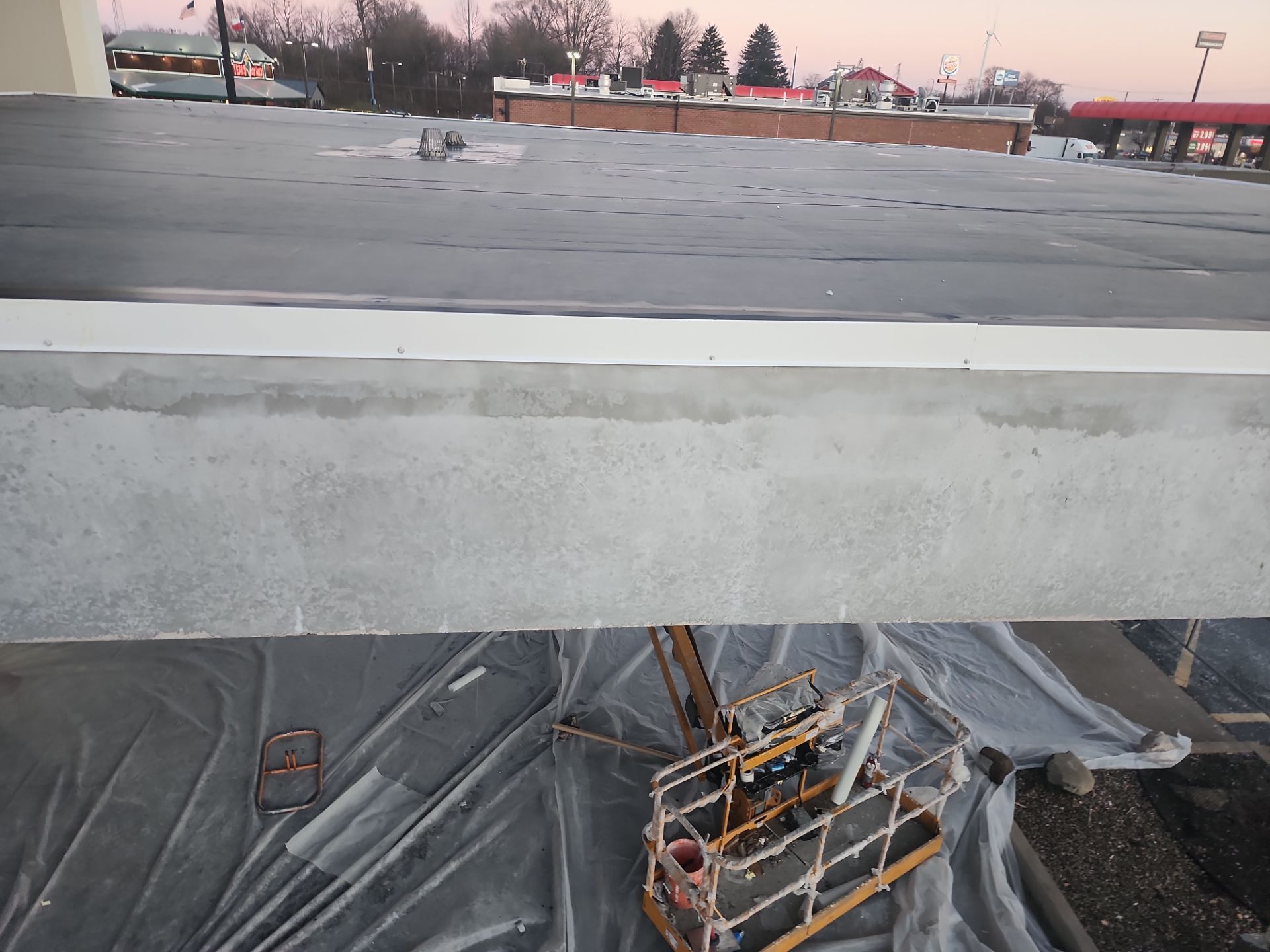 Commercial Roofing Installation using 60 mil rubber roof  by Nitro Roofing and Construction