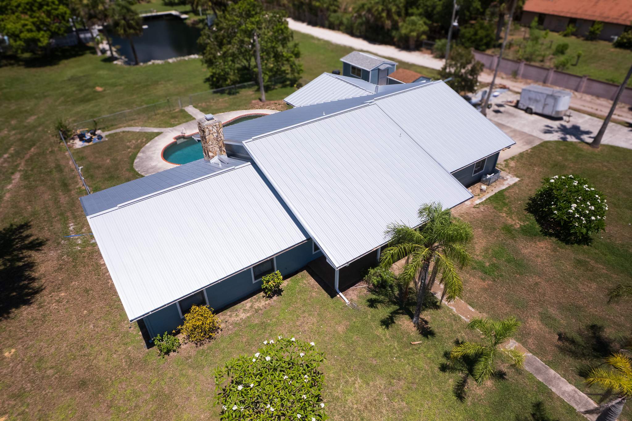 Standing Seam Metal Roof Replacement and Gutter Installation in Merritt Island by Wiedmann Construction & Roofing