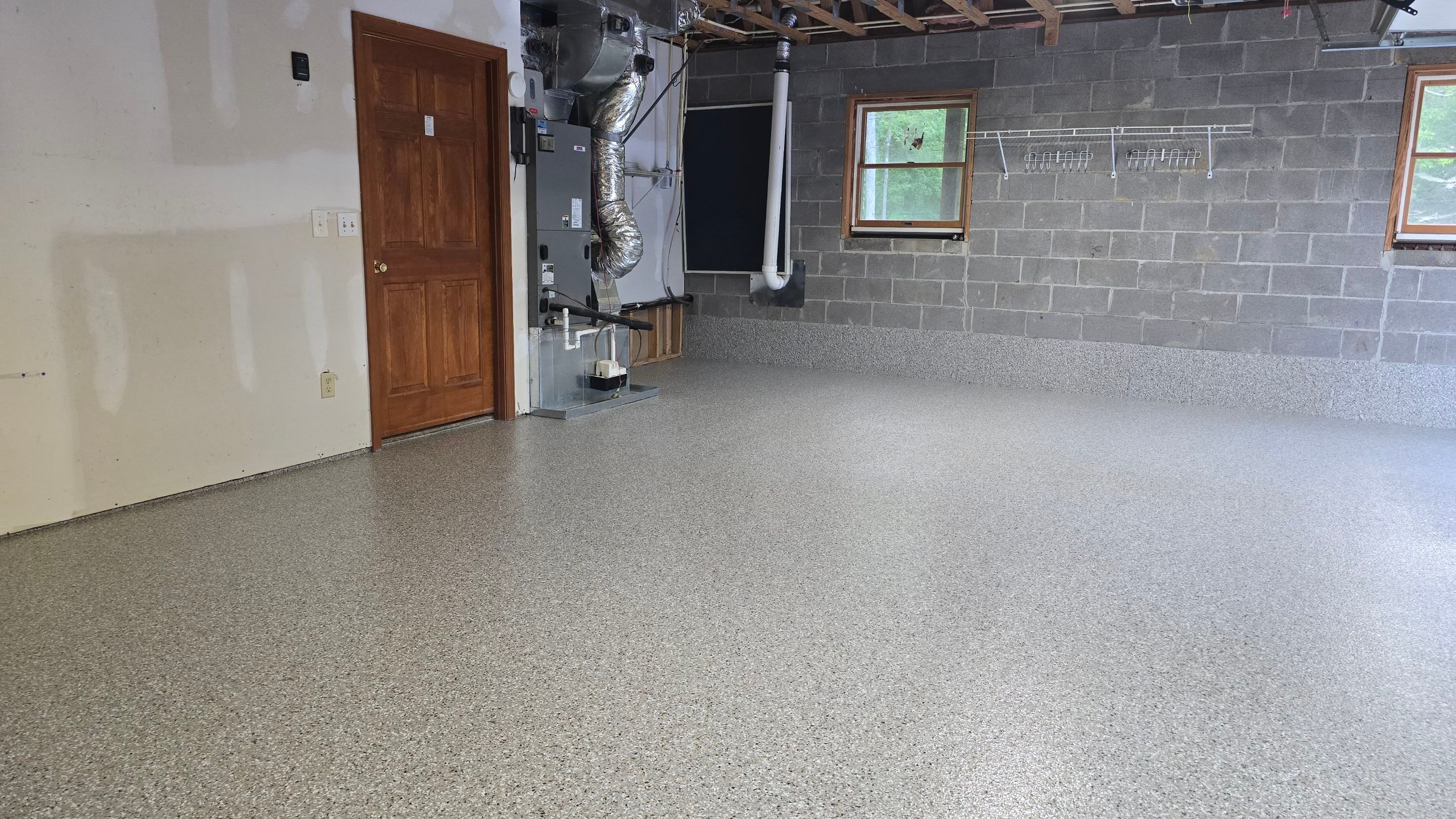 Garage & Porch Using Creekbed by Elite Floor Solutions